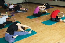 Annette Petrongelli, AS-4400 fitness and group fitness instructor leads her yoga class through one of her sessions, March 8. Yoga has many physical and mental benefits to a wide range of individuals. 