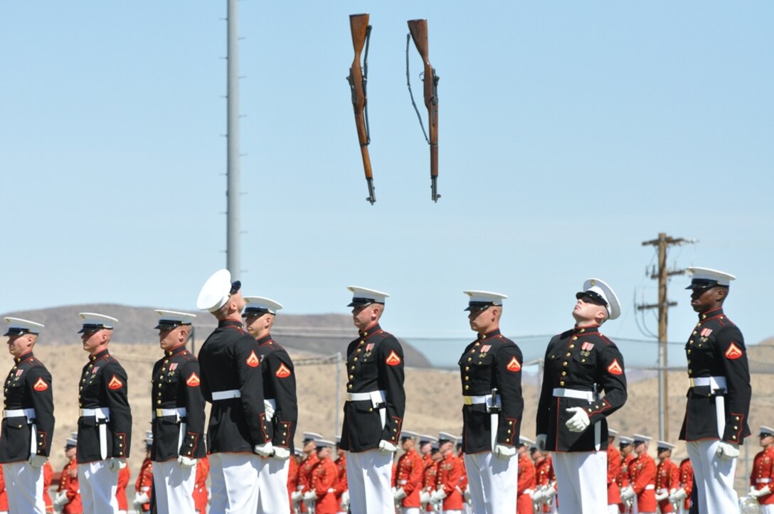 Marines with the Silent Drill Platoon from Marine Barracks Washington, D.C., perform precise and deliberate movements with their highly polished M1 rifles, as part of the Battle Color Detachment’s visit to Marine Corps Logistics Base Barstow, March 11. These Marines entertained the audience with their intricate drill routine, performed without verbal commands. The rifle inspector highlights the performance with an unrivaled inspection of his Marines, performing difficult rifle spins and exchanges.