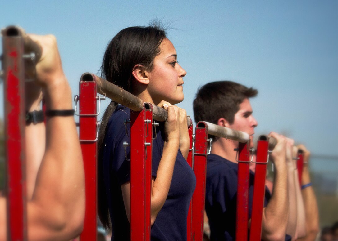 Poolees from Recruiting Station Phoenix perform the pull-up portion of the initial strength test during the RS's annual pool function, Mar. 2. Recruiters and officer selection officers have been provided training equipment and the Female Poolee PFT Prep Program in order to increase the upper body strength of female poolees and officer candidates ahead of changes to the female Physical Fitness Test (PFT). On Jan. 1, 2014, female Marines, recruits and officer candidates will perform dead-hang pull-ups instead of the current flexed arm-hang on their PFT. (US Marine Corps photo by Cpl. Tyler J. Bolken)
