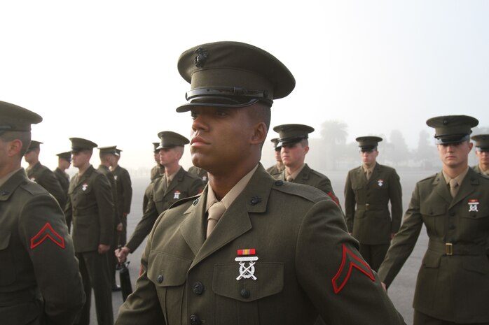 Pfc. Pierre Washington, Platoon 1051, Company C, 1st Recruit Training Battalion, stands at parade rest while waiting to be inspected during the Battalion Commanders Inspection March 12 aboard Marine Corps Recruit Depot San Diego. Washington has used his life obstacles as motivation to reach his goal of becoming a United States Marine.