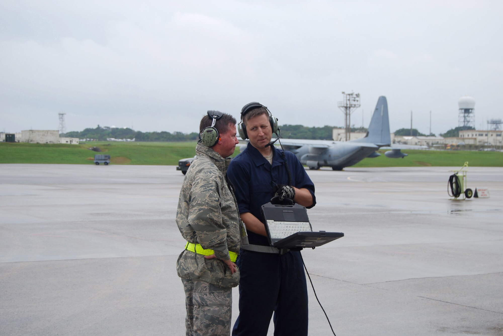 U.S. Air Force Master Sgts. Charles Burnett and Jeffery Parker, from the 733rd Air Mobility Squadron, check technical data during C-17 Globemaster III airlift aircraft jack training on Kadena Air Base, Japan. The 733rd AMS aircraft maintenance "Pacesetters" support Air Mobility Command's C-5, C-17, KC-10, and commercial contracted missions every day, sustaining U.S. military forces stationed in Okinawa and beyond. (U.S. Air Force courtesy photo)