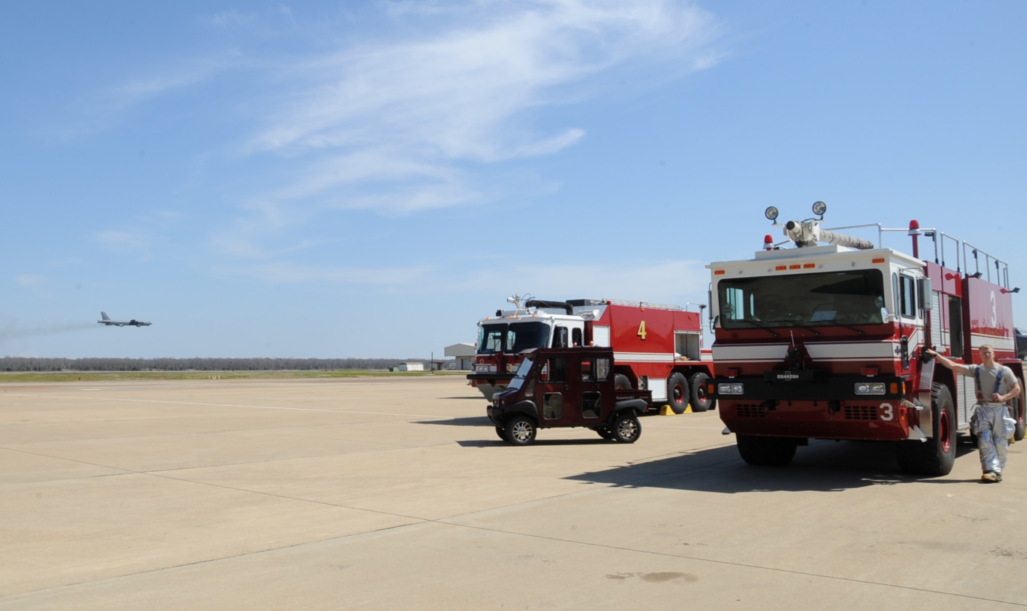 Fire fighters from the 2nd Civil Engineer Squadron standby during an aircraft egress exercise on Barksdale Air Force Base, La., March 14. The exercise ensured firefighters are trained and ready in the event of a real world emergency. (U.S. Air Force photo/Senior Airman Sean Martin)