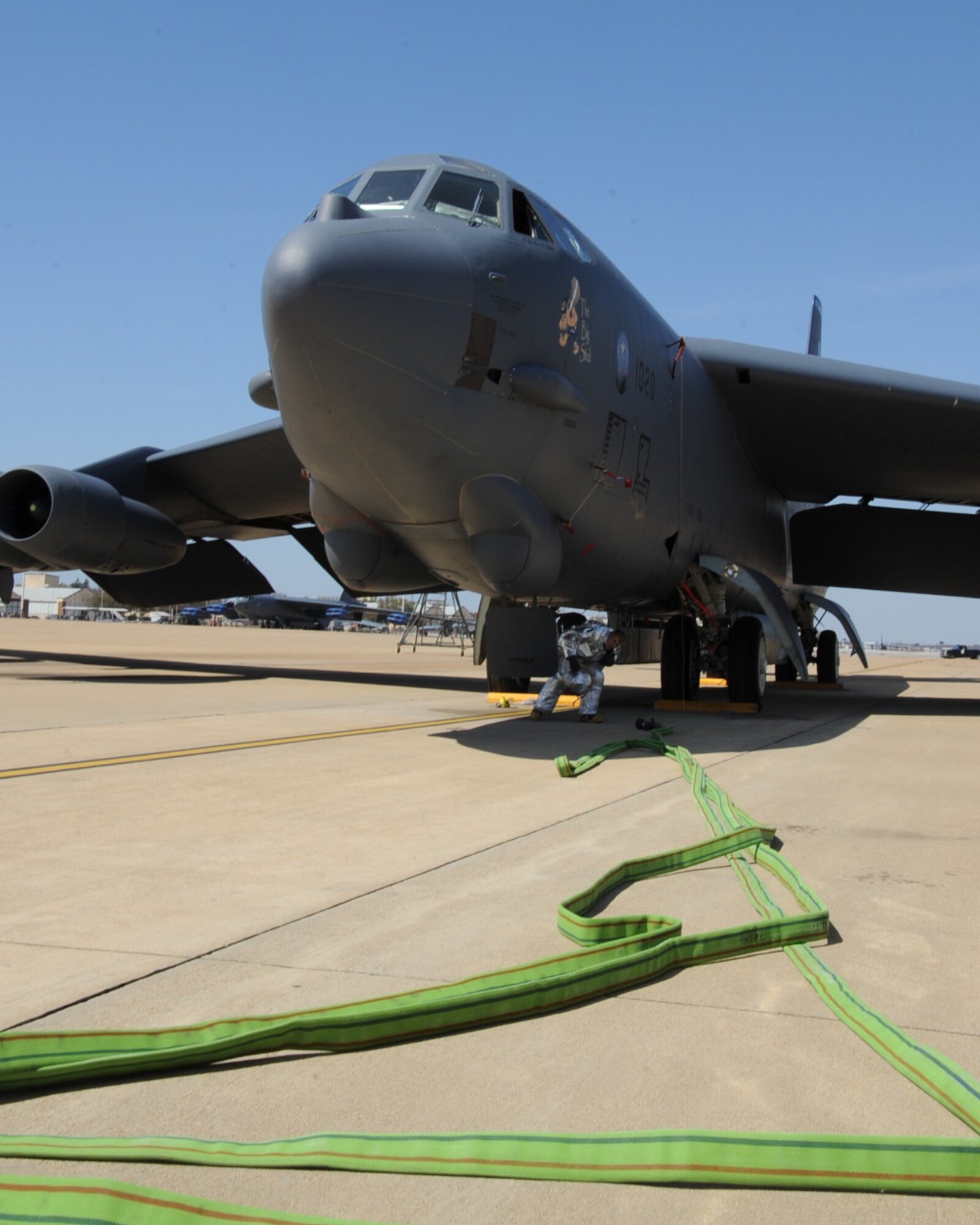 A firefighter from the 2nd Civil Engineer Squadron, exits a B-52H Stratofortress during an aircraft egress exercise on Barksdale Air Force Base, La., March 14. The exercise was conducted to ensure 2 CES firefighters are mission ready in the event of a real world emergency. (U.S. Air Force photo/Senior Airman Sean Martin)