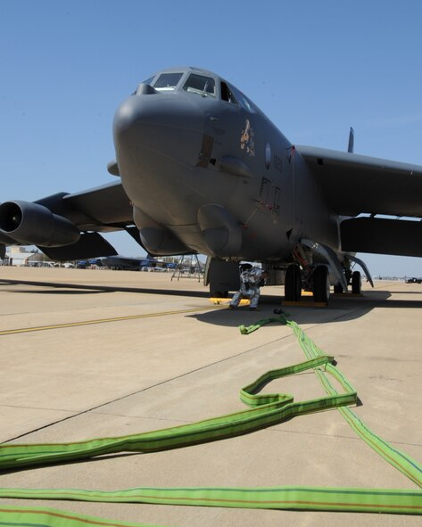 A firefighter from the 2nd Civil Engineer Squadron, exits a B-52H Stratofortress during an aircraft egress exercise on Barksdale Air Force Base, La., March 14. The exercise was conducted to ensure 2 CES firefighters are mission ready in the event of a real world emergency. (U.S. Air Force photo/Senior Airman Sean Martin)