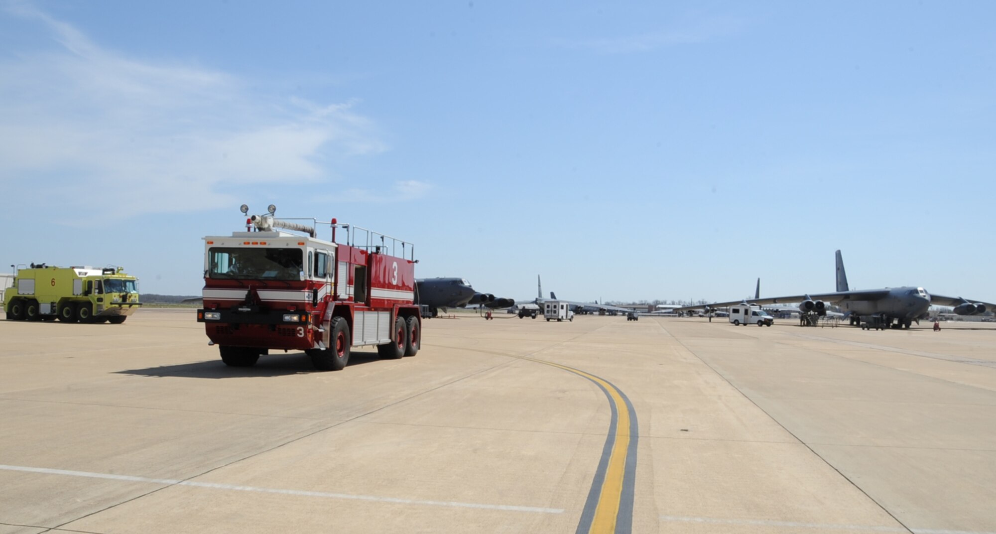 Fire trucks arrive on-scene during an aircraft egress exercise on Barksdale Air Force Base, La., March 14. The exercise was conducted to ensure 2nd Civil Engineer Squadron firefighters are mission ready in the event of a real world emergency. (U.S. Air Force photo/Senior Airman Sean Martin)