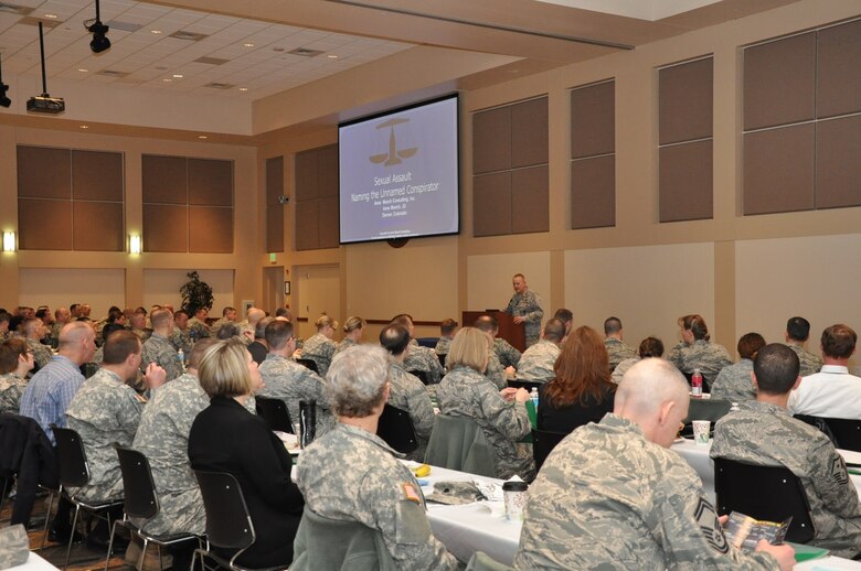 Col. Dan Dant, 460th Space Wing commander, gives opening remarks before a presentation from Anne Munch, a consultant and an advocate for victims of domestic violence, sexual assault and stalking, March 13, 2013, in the Leadership Development Center on Buckley Air Force Base, Colo. Munch spoke to more than 150 service member and civilian leaders from the 460th Space Wing, 140th Wing Air National Guard, Aerospace Data Facility-Colorado and Colorado Army National Guard, as well as representatives from the Sexual Assault Prevention and Response Programs. The former prosecutor provided insight into how leaders can better cultivate an environment of intolerance for sexual assault. (U.S. Air Force photo by Staff Sgt. Kali L. Gradishar/Released)