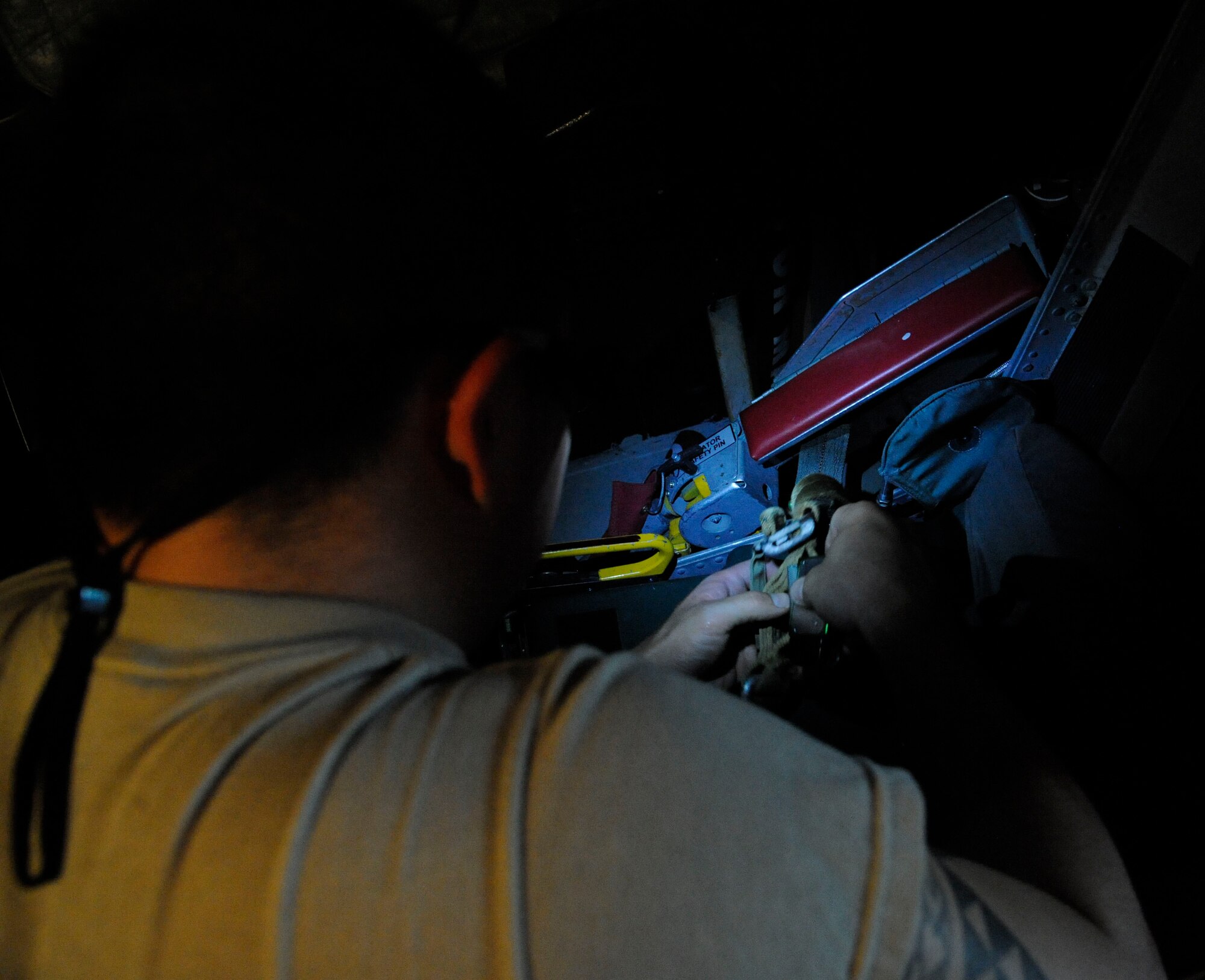 Airman 1st Class Todd Billow, 2nd Operations Support Squadron Aircrew Flight Equipment, installs a survival kit into a Weber B-52H Stratofortress ejection seat on Barksdale Air Force Base, La., March 14. The kits include life-saving equipment in the event of an egress to include flares, sea dye, a strobe light, tourniquet, knife and candle. (U.S. Air Force photo/Airman 1st Class Andrew Moua)