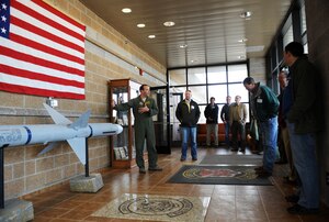 U.S. Air Force Lt. Col. David Brynteson, 391st Fighter Squadron commander, shows honorary commanders the AIM-7 Sparrow missile inside the 391st FS foyer March 13, 2013, at Mountain Home Air Force Base, Idaho. The civilian commanders were able to tour the building and meet with F-15E Strike Eagle fighter pilots. (U.S. Air Force photo/Senior Airman Benjamin Sutton) 