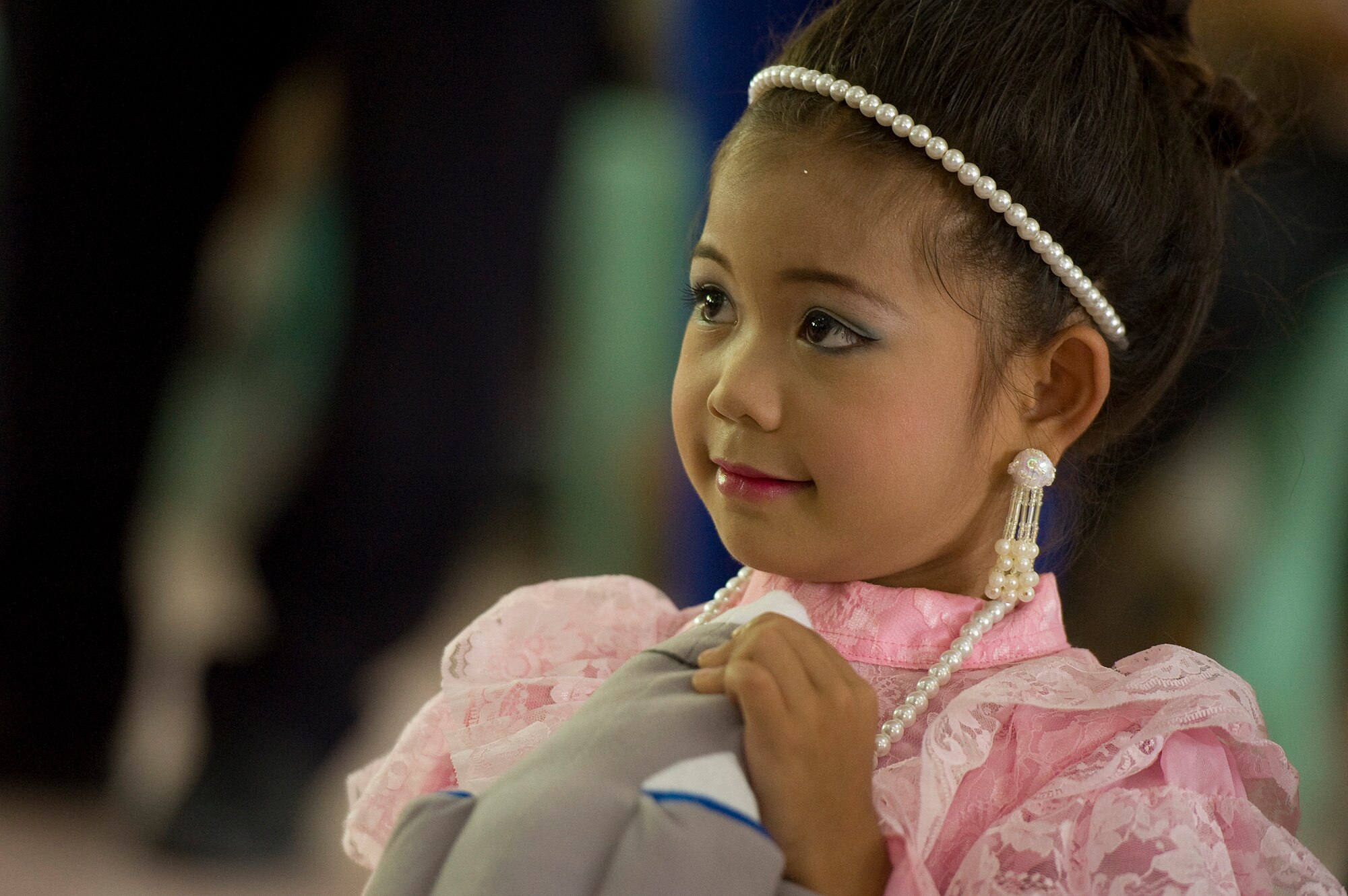 A student holds a stuffed toy donated by Cope Tiger 13 participants from the U.S. Air Force, Royal Thai Air Force and Republic of Singapore Air Force during a multilateral visit to Ban Palai School in Nakhon Ratchasima Province, Thailand, March 13, 2013. Airmen from each country donated computer equipment, school supplies, and athletic gear to the school during the multilateral engagement. More than 300 U.S. service members are participating in CT13, which offers an unparalleled opportunity to conduct a wide spectrum of large force employment air operations and strengthen military-to-military ties with two key partner nations, Thailand and Singapore. (U.S. Air Force photo/2nd Lt. Jake Bailey)