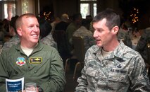 U.S. Air Force Chief Master Sgt. Matthew Wells (right), 23d Wing command chief, talks to Col. Steven Ramer, 23d WG vice commander, during Moody’s National Prayer Luncheon March 7, 2013 at Moody Air Force Base, Ga. Wells took over as the 23d WG command chief after Chief Master Sgt. Frank Batten deployed to Afghanistan in mid-February. (U.S. Air Force photo by Senior Airman Jarrod Grammel/Released)
