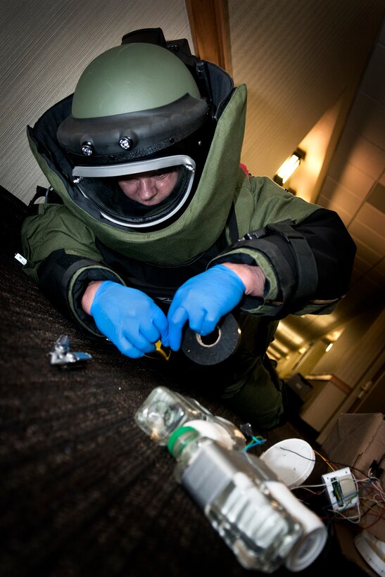 GRISSOM AIR RESERVE BASE, Ind. -- Tech. Sgt. Robert Woods, 434th Civil Engineer Squadron explosives ordnance disposal technician, renders safe a simulated improvised explosive device during an EOD exercise held here Feb. 21. EOD technicians use a multitude of tools to help them best tackle each unique device. (U.S. Air Force photo/Tech. Sgt. Mark R. W. Orders-Woempner)