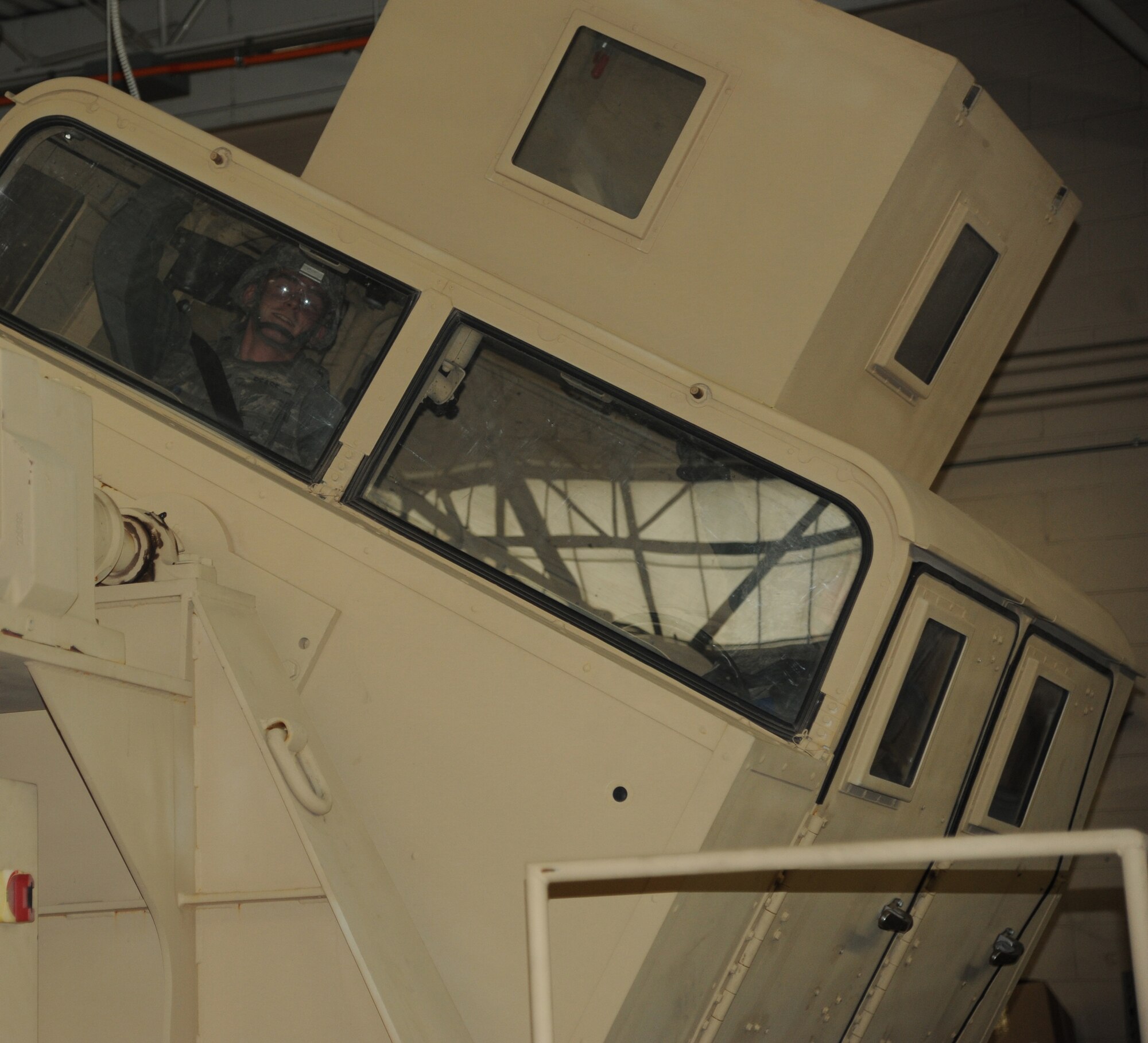 Senior Airman Gregory Pease, 341 Missile Security Forces Squadron response force leader, practices seatbelt confidence in the Humvee Egress Assistance Trainer on March 7. Airmen were briefed to wait for the command, ‘Egress,’ before they removed their seatbelt and safely exited the trainer. (U.S. Air Force photo/Airman 1st Class Katrina Heikkinen)