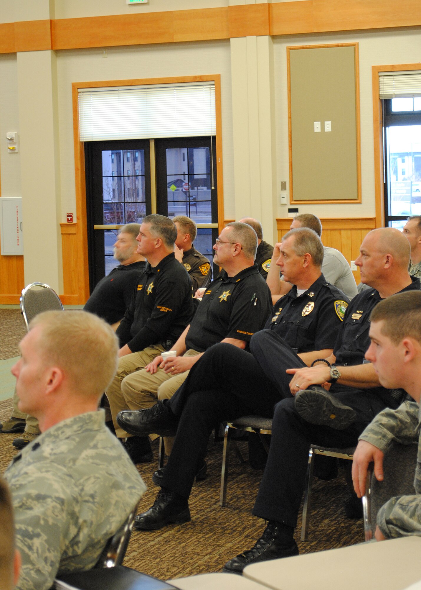 Members of the Great Falls Police Department and Cascade County Sheriff’s Office listen to a briefing given by Malmstrom’s 341st Security Forces Group commander.  These were only two agencies of several across Montana attending the event March 12.  (U.S. Air Force photo/Senior Airman Cortney Paxton) 
