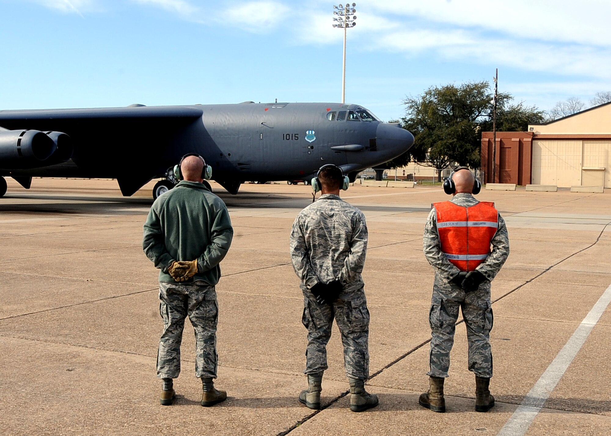 Chief Master Sgt. Brian Hornback, Air Force Global Strike Command command chief, prepares to marshal a B-52H Stratofortress with Airmen from the 20th Aircraft Maintenance Squadron on Barksdale Air Force Base, La., March 7. Hornback got the opportunity to relive his junior enlisted days as a B-52 crew chief on a recent visit to the 2nd Bomb Wing. (U.S. Air Force photo/Staff Sgt. Jason McCasland)
