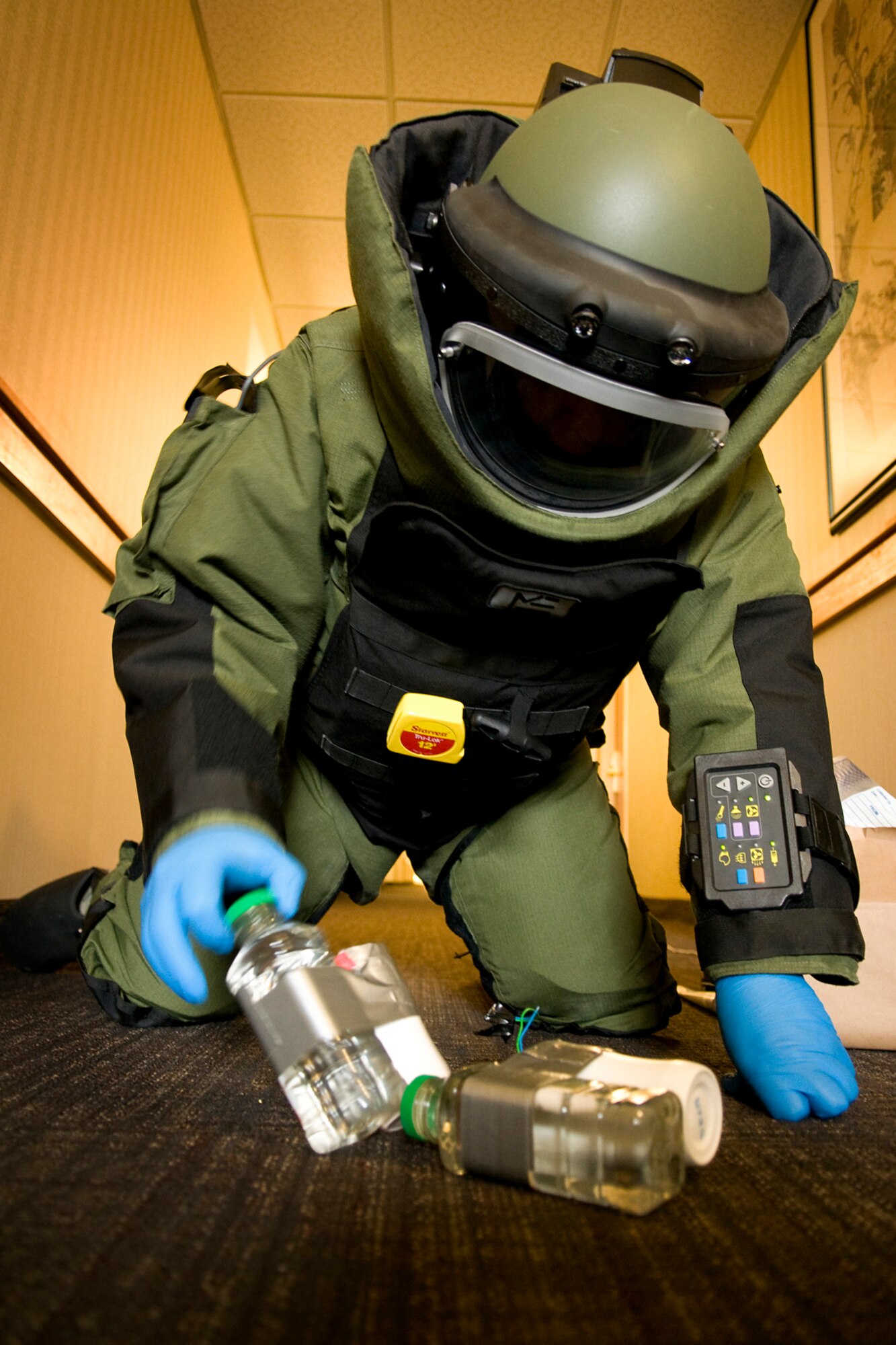 GRISSOM AIR RESERVE BASE, Ind. -- Tech. Sgt. Robert Woods, 434th Civil Engineer Squadron explosives ordnance disposal technician, moves simulated explosives into position so he can safely remove them with a robot during an EOD exercise held here Feb. 21. The EOD flight is new here at Grissom and is one of four such new units in the Air Force Reserve Command. (U.S. Air Force photo/Tech. Sgt. Mark R. W. Orders-Woempner)
