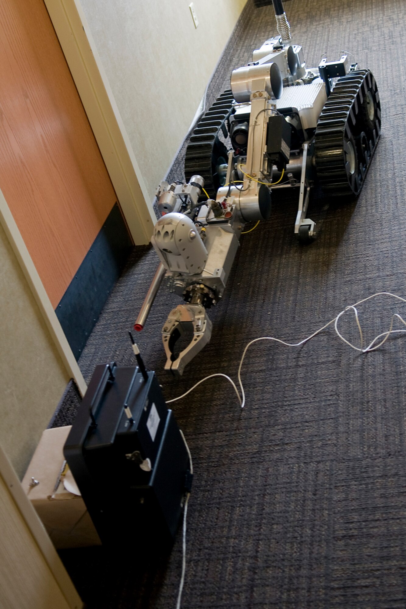 GRISSOM AIR RESERVE BASE, Ind. -- An Air Force medium sized robot moves in close to a simulated improvised explosive device during an explosive ordnance disposal training exercise at the Grissom Services Complex here Feb. 21. 434th Civil Engineer Squadron explosives ordnance disposal technicians use robots to examine and render safe potential explosive threats. (U.S. Air Force photo/Tech. Sgt. Mark R. W. Orders-Woempner)
