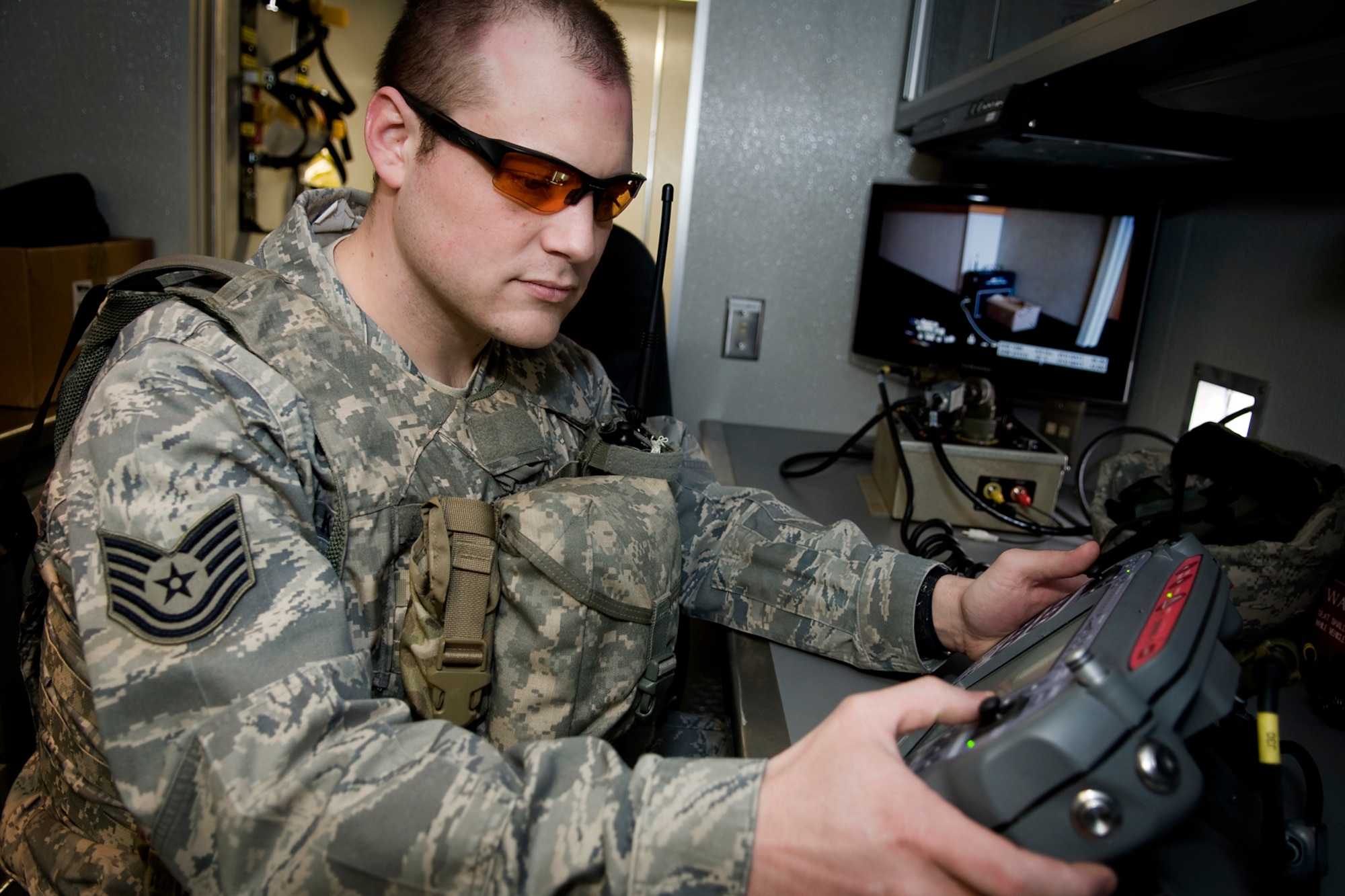 GRISSOM AIR RESERVE BASE, Ind. -- Tech. Sgt. Justin Krautkremer, 434th Civil Engineer Squadron explosives ordnance disposal technician, operates an Air Force medium sized robot during a recent EOD training exercise here Feb 21. EOD technicians use robots to examine and render safe potential explosive threats. (U.S. Air Force photo/Tech. Sgt. Mark R. W. Orders-Woempner)
