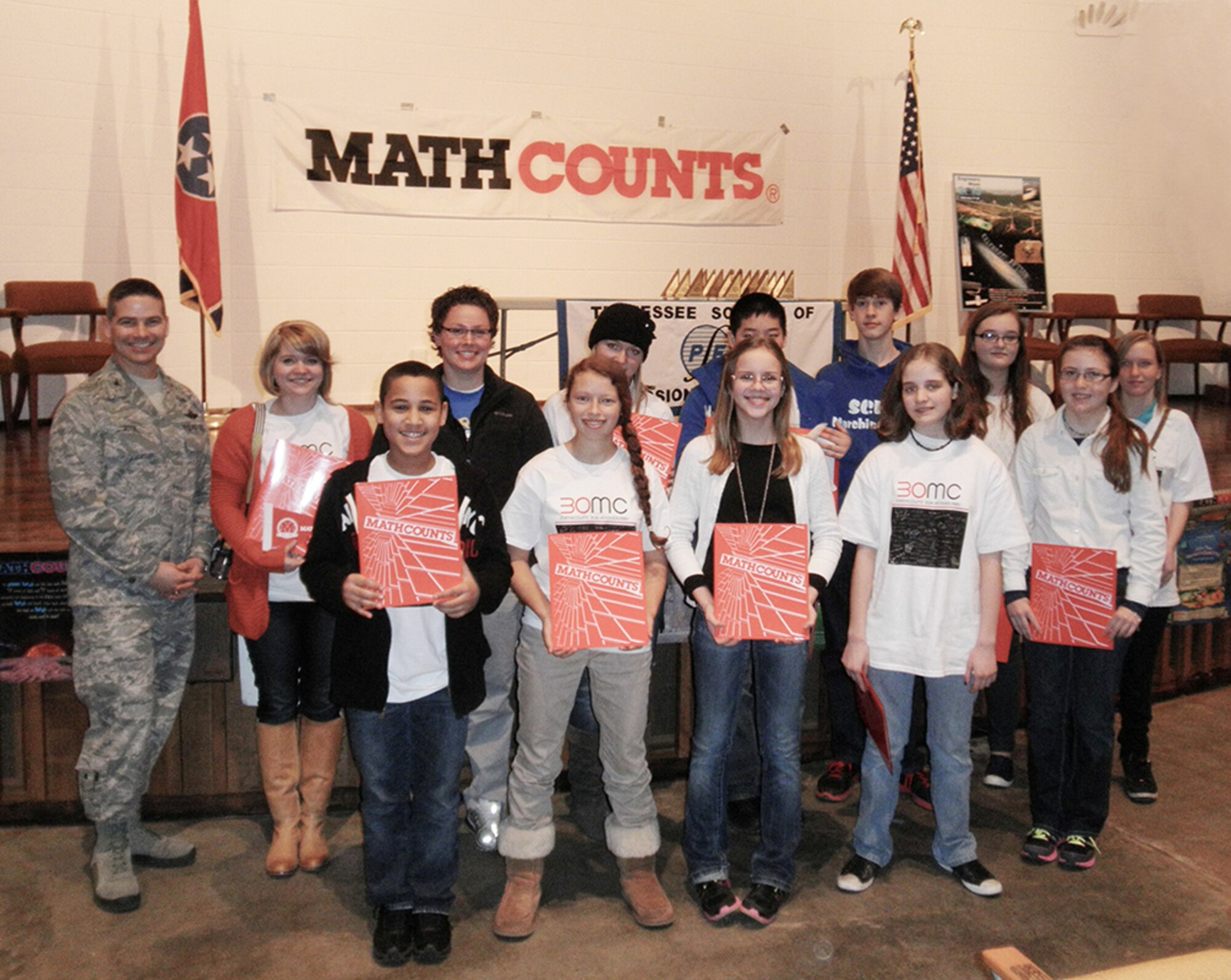 Pictured here are first-time MathCounts competitors from Harris Middle School, including (front row, left to right) Bryan young, 7th grader; Maddie Northcutt, 7th grader; Meghan Barnett, 6th grader;  Kassidy Brown, 7th grader; and Taylor Overcast, 7th grader; back row, from left, Arnold Engineering Development Complex Commander, Col. Raymond Toth, Chelsea Philpott (coach), Olivia Birkey (coach), Britney Herman, 8th grader; Denny Pan, 8th grader; Jesse Smotherman, 8th grader; Menley Saylor, 8th grader; and Marina Nelson, 8th grader. (Photo provided)

