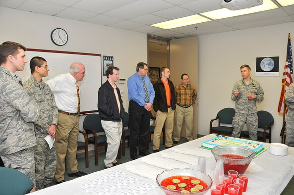 From left, Capt. Nicholas Bauer, STAT test director / conductor; Lt. Akshay Tripathi, STAT test conductor; Mike Ketron, Space CTF director; Alex Freehardt, STAT lead test conductor; Jim Nichols, STAT test director and lead analyst; Steve Macarino, STAT test conductor; and Jim Burns, CTF technical director, listen as Lt. Col. Gregg Leisman, AEDC Space and Missile Test Chief welcomes the team and celebrated stand-up of the new organization within his mission area. (Photo by Jacqueline Cowan)