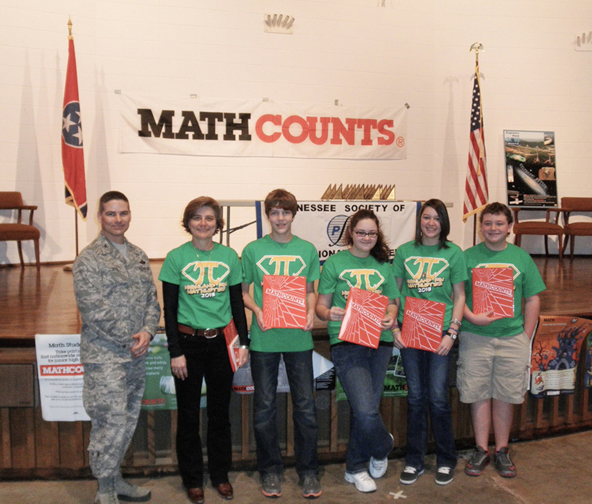 Pictured here are first-time MathCounts competitors from Harris Middle School, including (front row, left to right) Bryan young, 7th grader; Maddie Northcutt, 7th grader; Meghan Barnett, 6th grader;  Kassidy Brown, 7th grader; and Taylor Overcast, 7th grader; back row, from left, Arnold Engineering Development Complex Commander, Col. Raymond Toth, Chelsea Philpott (coach), Olivia Birkey (coach), Britney Herman, 8th grader; Denny Pan, 8th grader; Jesse Smotherman, 8th grader; Menley Saylor, 8th grader; and Marina Nelson, 8th grader. (Photo provided)