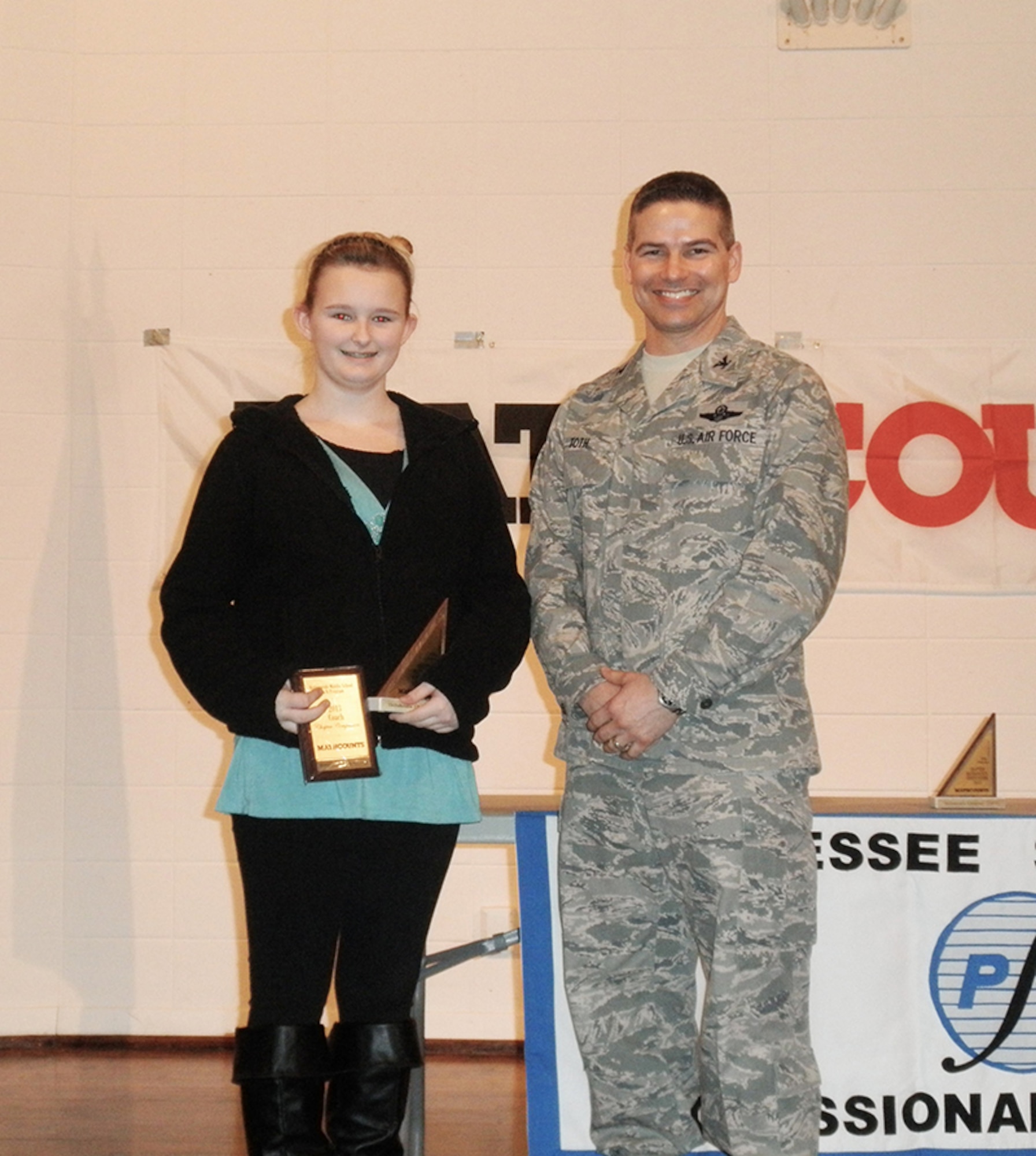 From left, Arnold Engineering Development Complex Commander, Col. Raymond Toth with West Middle School’s Kelsi Burt, second place individual winner. (Photo provided)