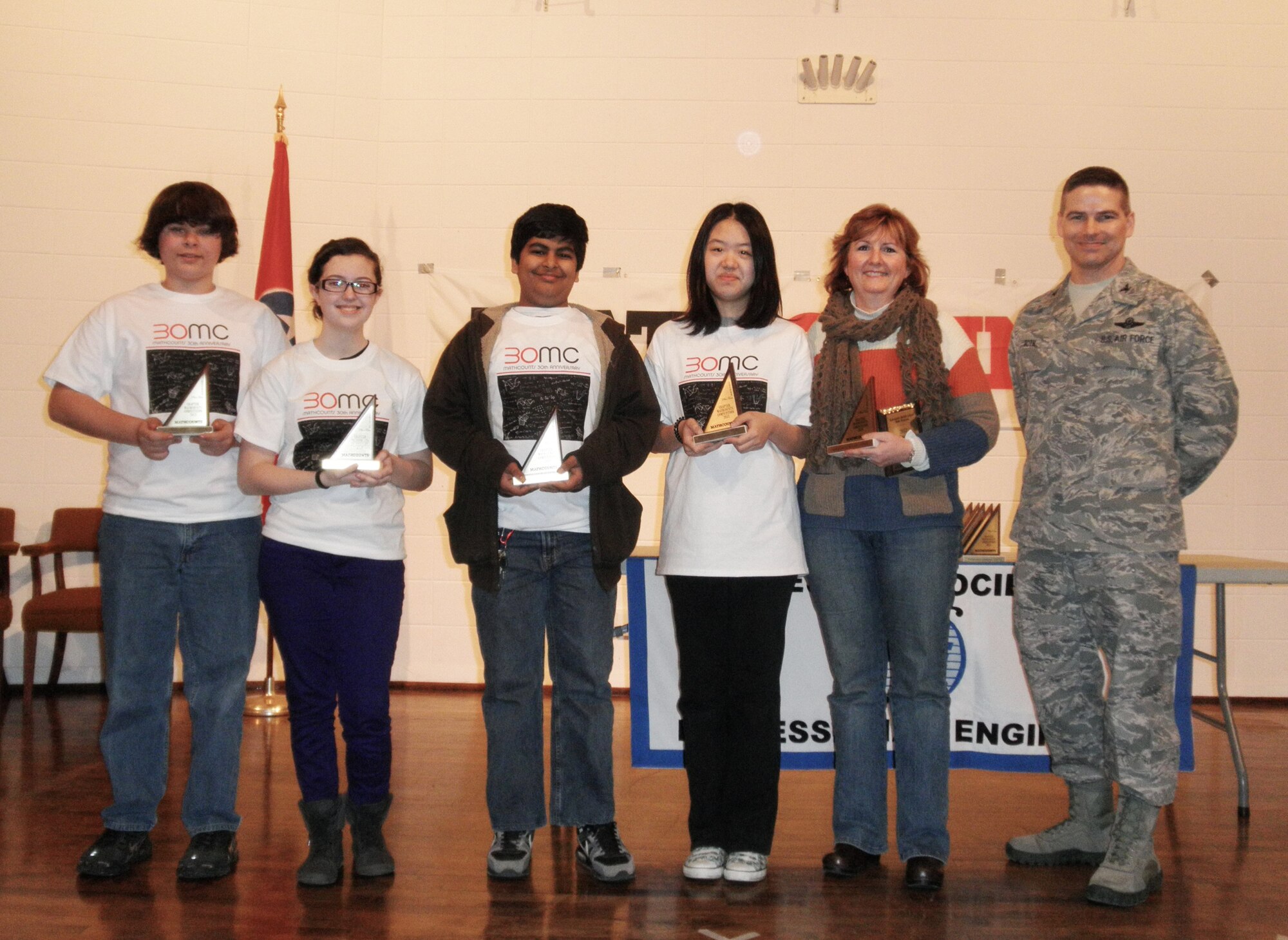 From left to right, Keaton Pendergrast, Madie McAndrew, Yash Mansharman, Corrina Zhang and Lea Anne Windham, coach and math department chair from Wartrace, Tenn., pose with AEDC Commander Col. Raymond Toth after the Webb School team from Bell Buckle earned second place in the local 2013 MathCounts competition held Feb. 16 at the University of Tennessee Space Institute. (Photo provided)