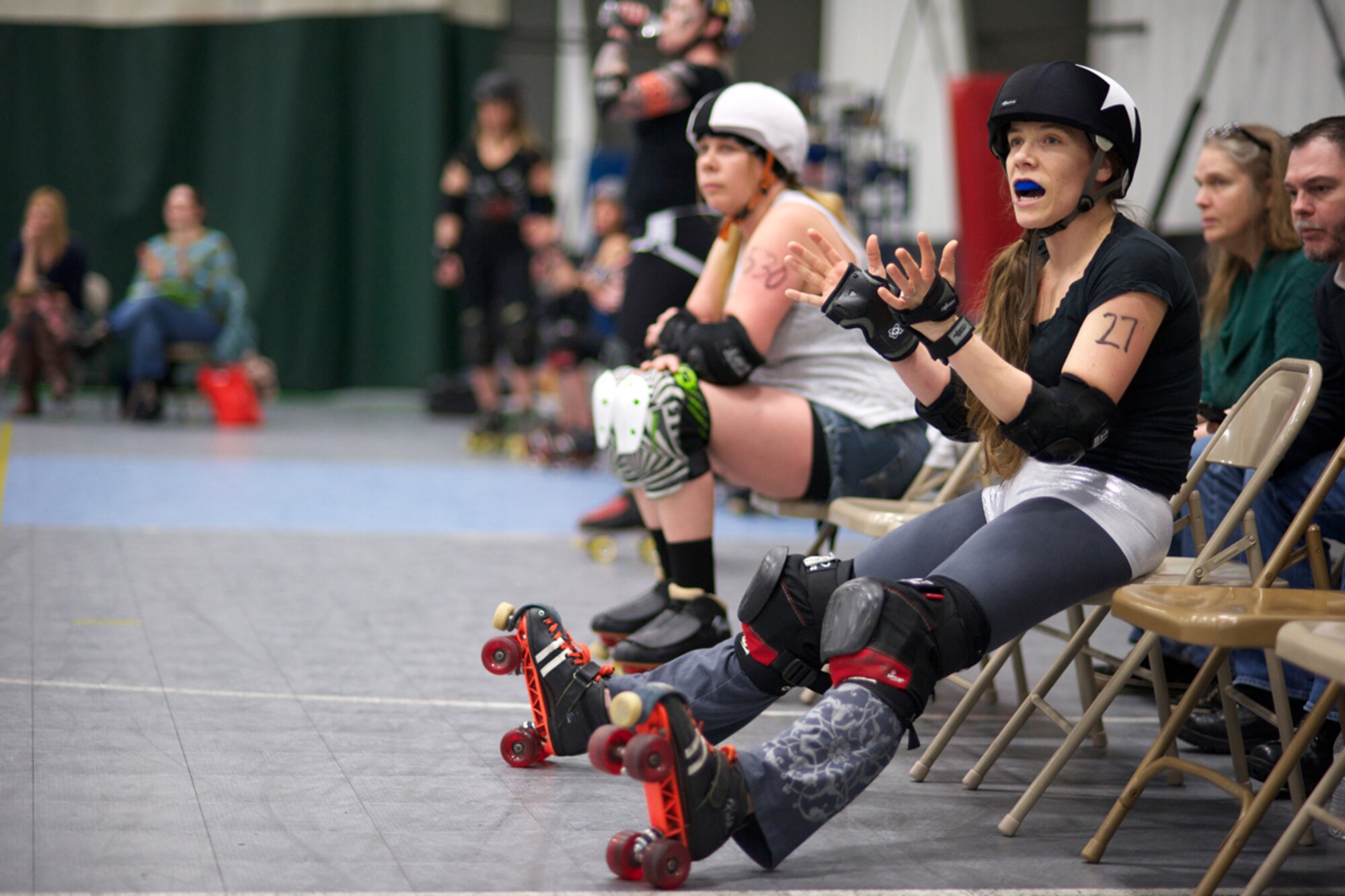 JOINT BASE ELMENDORF-RICHARDSON, Alaska -- Senior Airman Kendall Nielsen, 477th Fighter Group, takes a break in the penalty box during roller derby practice in Anchorage Feb. 7. Jammers are identified by the star they wear on their helmet covers. (U.S. Air Force photo/David Bedard)