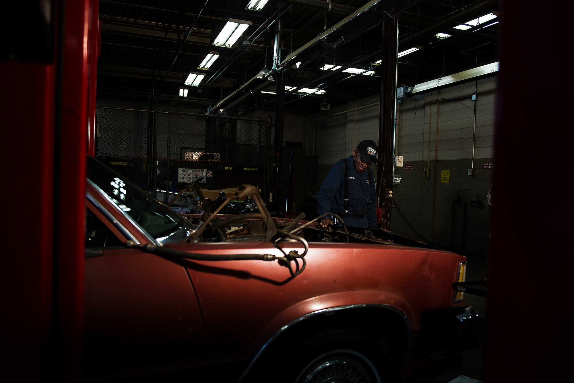 Parnell Fisher works on a car in the Auto Hobby shop Feb. 26, 2013, at Little Rock Air Force Base, Ark. Fisher, now 80 years old, has witnessed many changes in the Air Force during his lifetime and credits the end of racial segregation as his most cherished memory.  (U.S. Air Force photo by Staff Sgt. Russ Scalf)