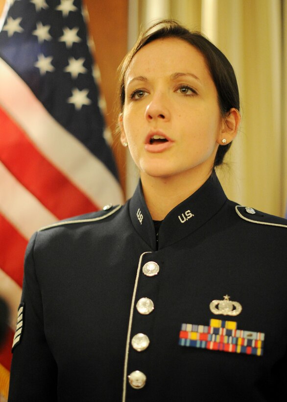 Tech. Sgt. Emily Wellington, U.S. Air Force Band vocalist, sings the National Anthem during a Women's History Month event at Joint Base Andrews, Md., Mar. 8, 2013. The theme of the event, "Women inspiring innovation through imagination," emphasized empowering women through technology. (U.S. Air Force photo/ Staff Sgt. Nichelle Anderson)