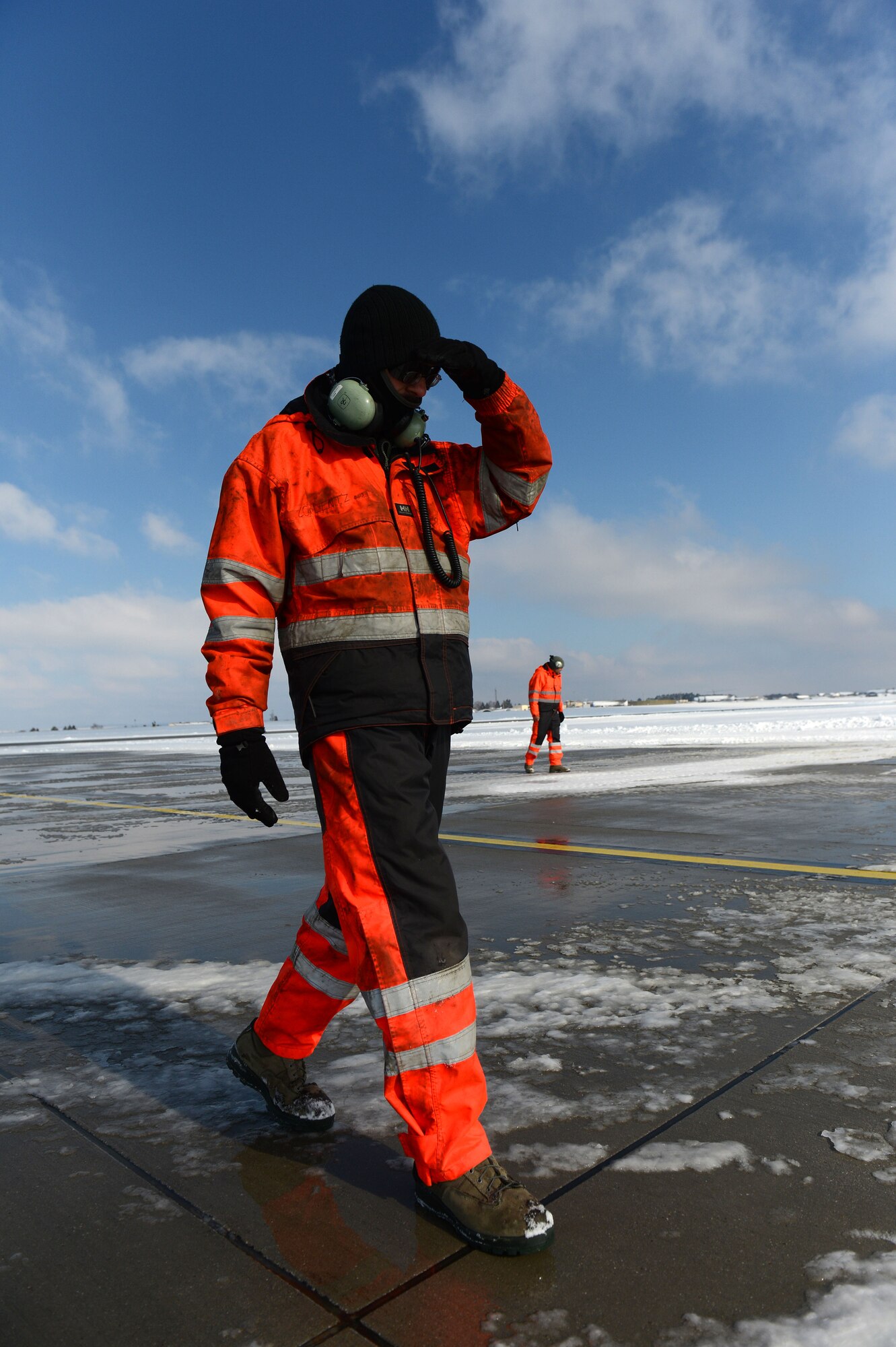 SPANGDAHLEM AIR BASE, Germany – U.S. Air Force Staff Sgt. Paul Coblentz, 726th Air Mobility Squadron aircraft maintenance technician from Milwaukee, searches for debris on the flightline March 13, 2013. Debris must be removed to prevent damage to aircraft. (U.S. Air Force photo by Airman 1st Class Gustavo Castillo/Released)  