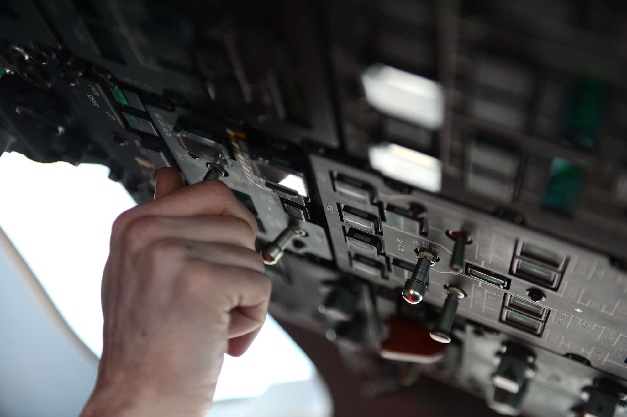 SPANGDAHLEM AIR BASE, Germany – U.S. Air Force Senior Airman Joshua Kujawa, 726th Air Mobility Squadron integrated flight control technician from Toms River, N.J., turns on the auxiliary power unit of a C-17 Globemaster III March 13, 2013. The APU is used to power parts of the aircraft when it is at rest if external power units are not available. (U.S. Air Force photo by Airman 1st Class Gustavo Castillo/Released)