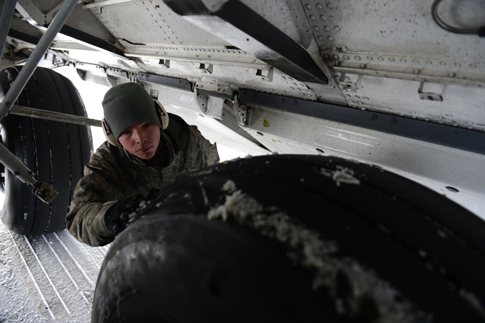 SPANGDAHLEM AIR BASE, Germany – U.S. Air Force Airman 1st Class Michael Bosch, 446th Aircraft Maintenance Squadron crew chief from Fedoa, Wash., checks the tires on a C-17 Globemaster III March 13, 2013. The 446th AMXS is assisting the 726th Air Mobility Squadron with airflow during a two-week temporary duty. (U.S. Air Force photo by Airman 1st Class Gustavo Castillo/Released) 