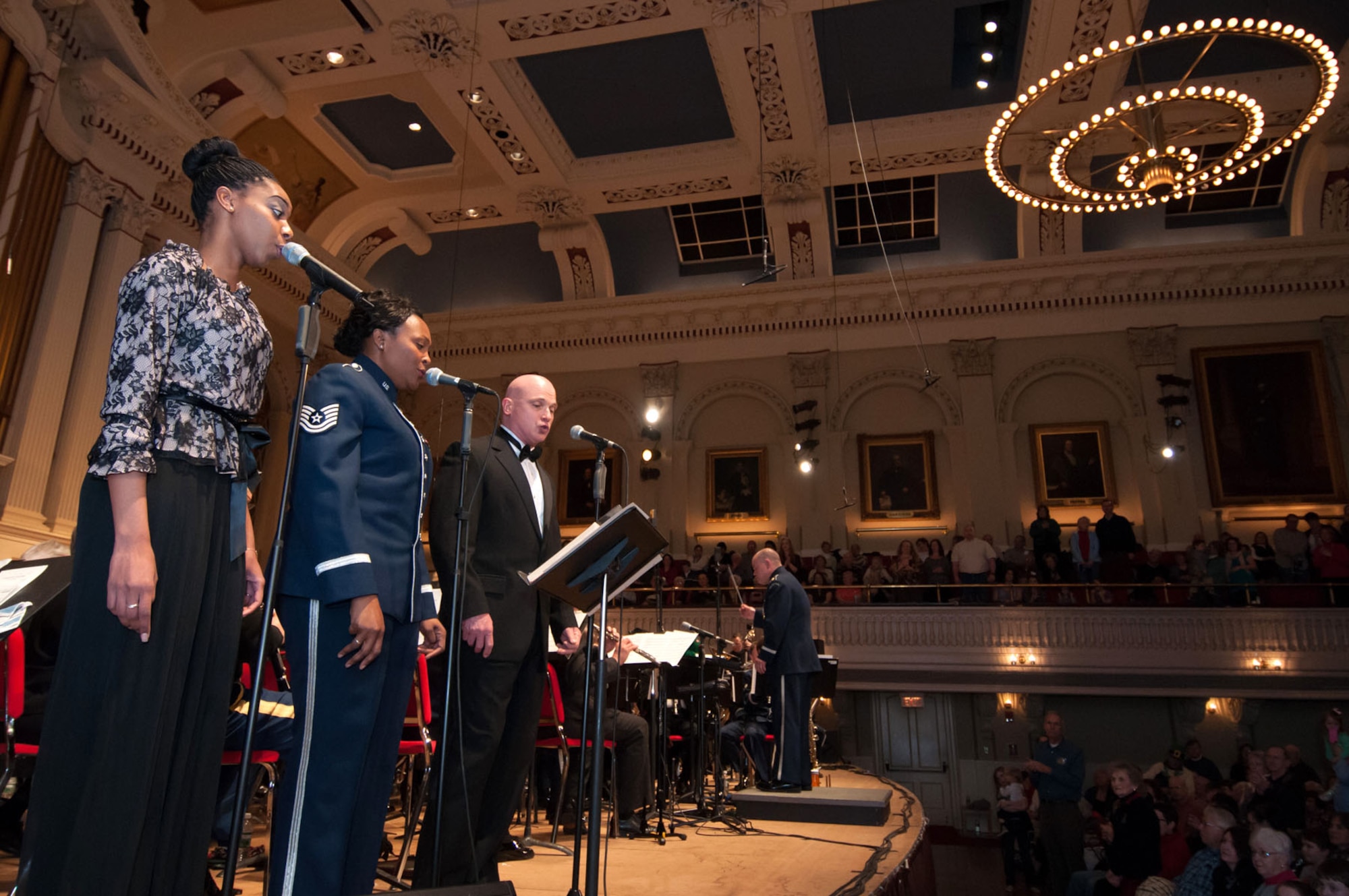 WORCESTER, Mass. -- (from left to right) Airman First Class Ashley Cook, Tech. Sgt. Keisha Gwin-Goodin and retired Chief Master Sgt. Chris Edris perform the Armed Services Medley as part of an afternoon performance at Mechanics Hall March 10. Gwin-Goodin and Edris are among the former band members who returned to perform with the band one last time. The band will deactivate this summer due to last year's Air Force restructuring. (U.S. Air Force photo by Rick Berry)