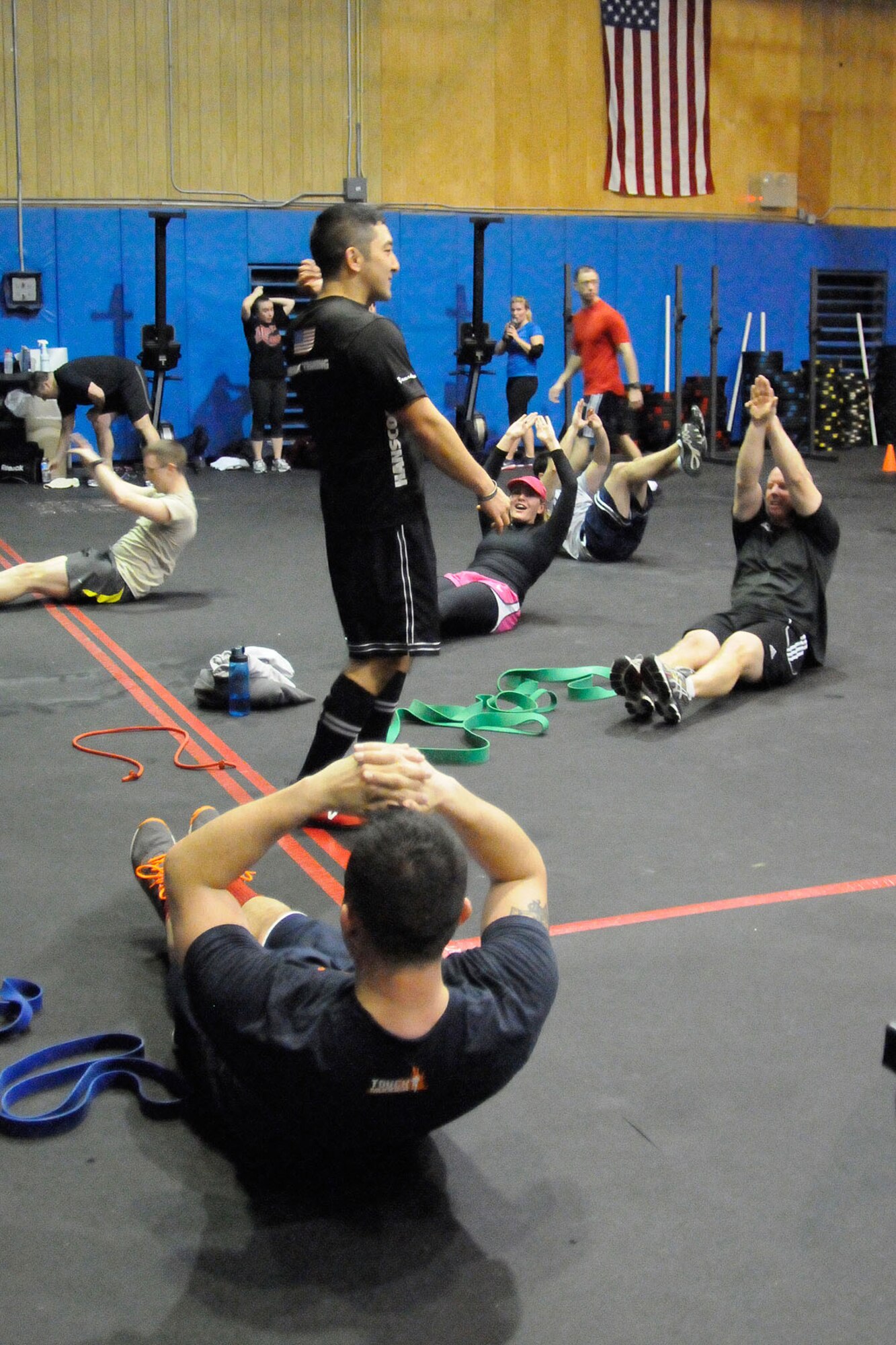 HANSCOM AIR FORCE BASE, Mass. -- CrossFit staff members work out with base personnel March 6 at the Fitness and Sports Center as part of the monthly Warrior Day. The Hanscom Warrior Training Center accommodates specialized equipment for CrossFit classes. For more information, go to www.hanscomwarriortraining.org. (U.S. Air Force photo by Linda LaBonte Britt)