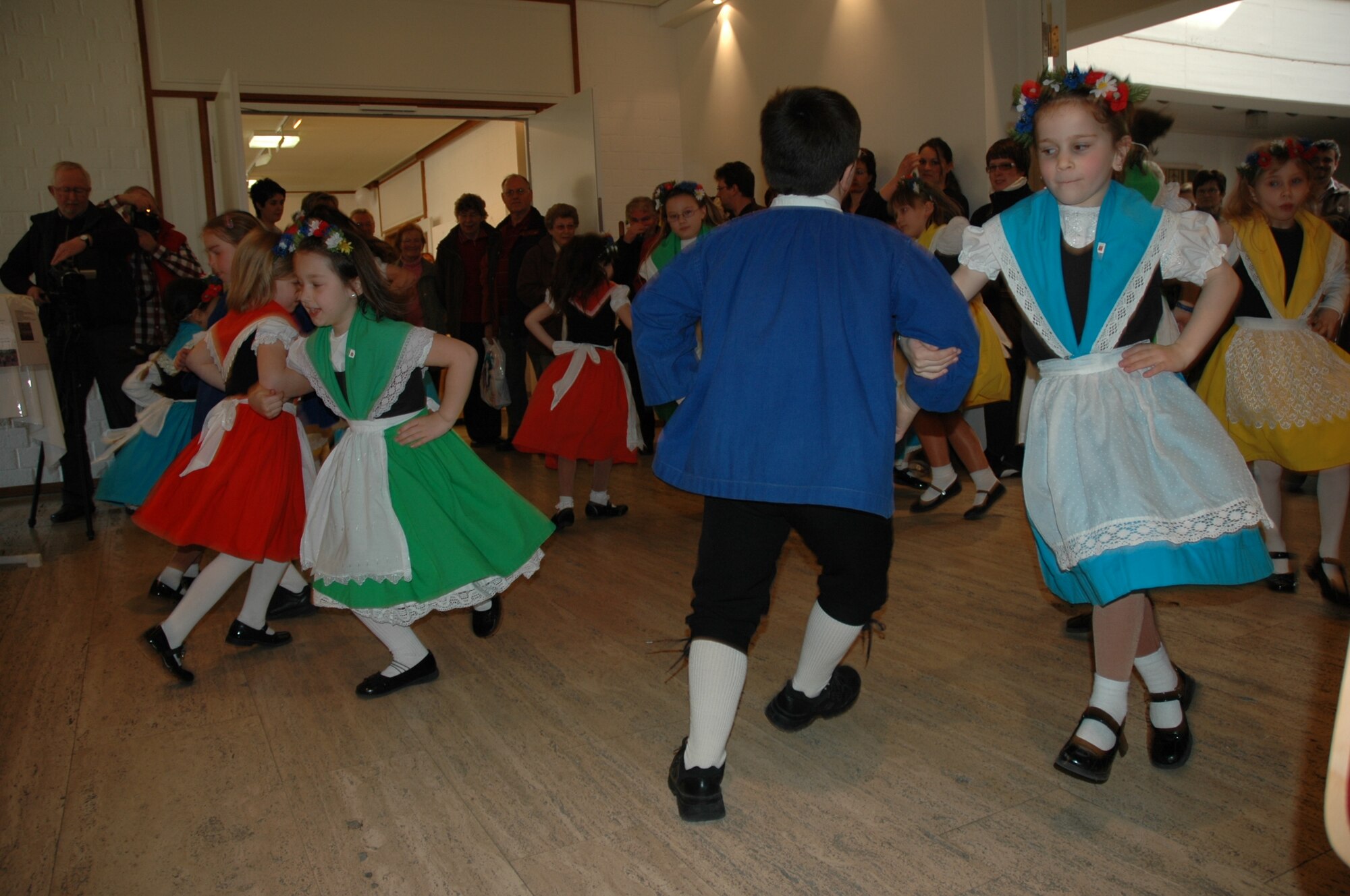 SPANGDAHLEM AIR BASE, Germany -- Children of a local folk square dance group
perform a dance inside the Beda Haus cultural center during a past Beda
market event. Inside the Beda market, people can also find a book flea
market. (U.S. Air Force photo by Iris Reiff/Released) 