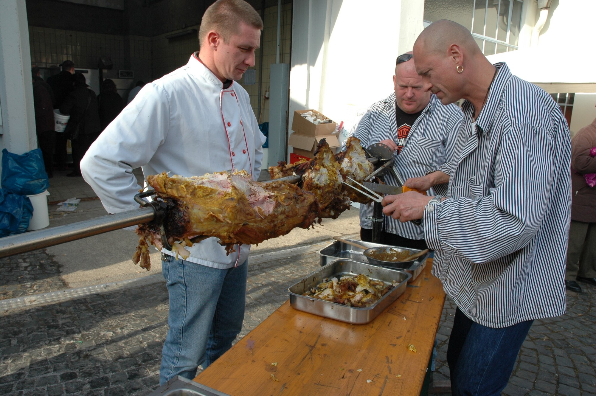 SPANGDAHLEM AIR BASE, Germany -- Butchers from Bitburg offered
roasted pork meat at a Beda Market event in 2009. Besides tasting
traditional food items, visitors can expect to see crafts made by local
craftsmen, classic vehicles and much more. This year's event will take place
March 15-17. Stores will open from 1-6 p.m. March 17, which is a Sunday.
(U.S. Air Force photo by Iris Reiff/Released)
