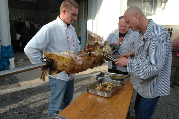 SPANGDAHLEM AIR BASE, Germany -- Butchers from Bitburg offered
roasted pork meat at a Beda Market event in 2009. Besides tasting
traditional food items, visitors can expect to see crafts made by local
craftsmen, classic vehicles and much more. This year's event will take place
March 15-17. Stores will open from 1-6 p.m. March 17, which is a Sunday.
(U.S. Air Force photo by Iris Reiff/Released)
