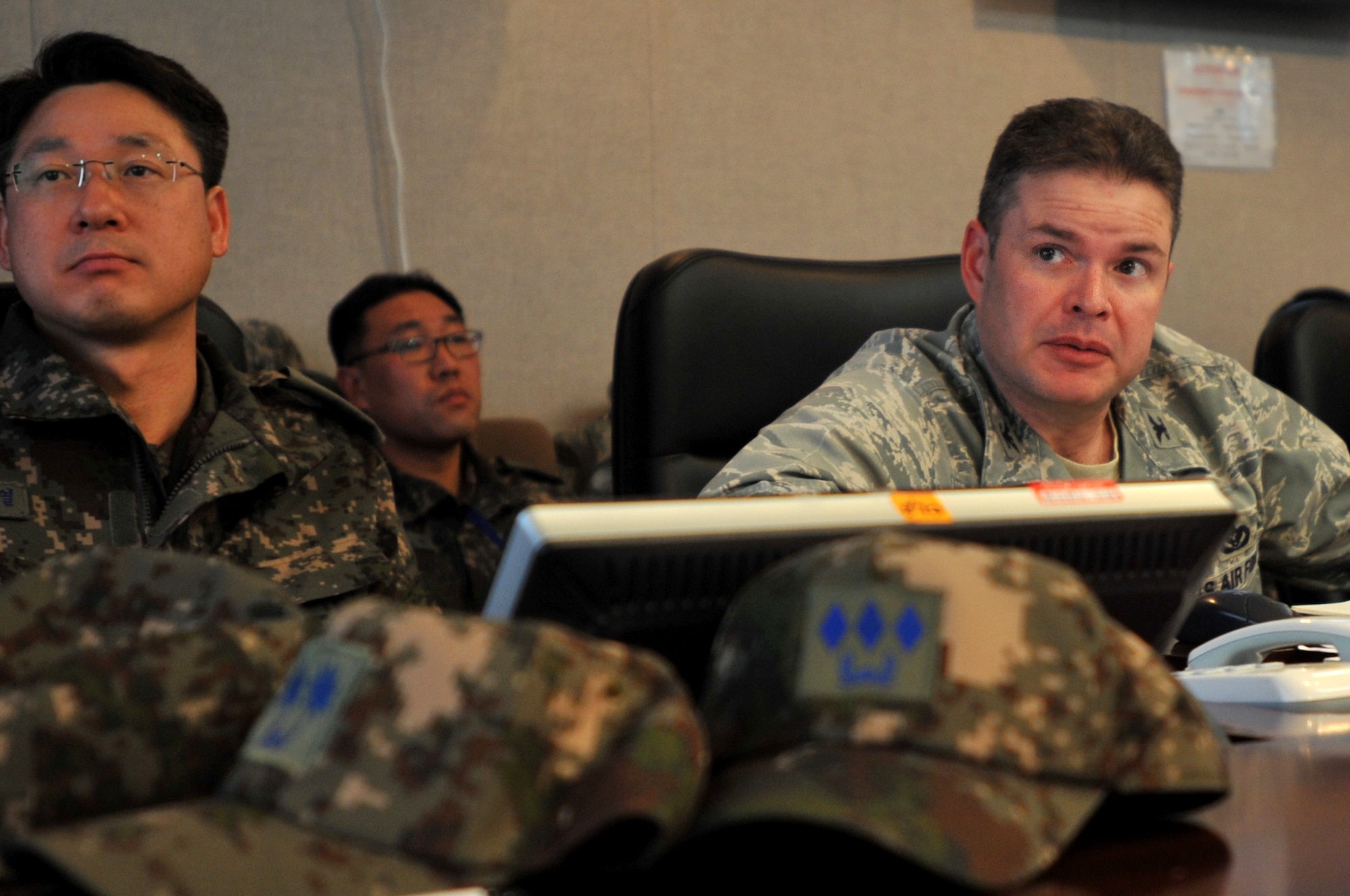 U.S. Air Force Col. David Bruce, 7th Air Force installations and mission support director, gives the status report at a command staff briefing during Exercise Key Resolve on Osan Air Base, Republic of Korea, March 14, 2013. Training exercises like Key Resolve are carried out in the spirit of the 1953 Republic of Korea-U.S. Mutual Defense Treaty. These exercises highlight the longstanding partnership and enduring friendship between the United Nations Command sending state nations while reaffirming the U.S. commitment to the region. (U. S. Air Force photo/Airman 1st Class Hailey R. Davis)