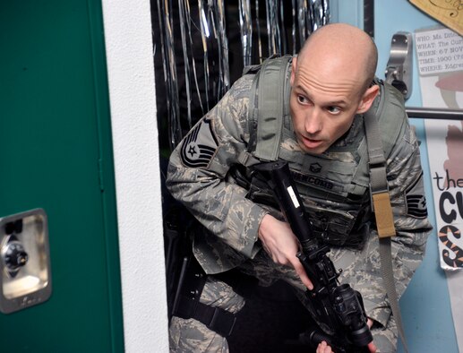 U.S. Air Force Master Sgt. William Newcomb, 35th Security Forces Squadron NCO in charge of training, posts security during a Pacific Air Forces High Risk Response Training exercise at Misawa Air Base, Japan, March 7, 2013. Training exercises such as this give 35th SFS Airmen the skills and knowledge to help them prepare for “what if” scenarios. Their continued performance helped them earn the PACAF 2012 Outstanding Medium Security Forces Unit award. (U.S. Air Force photo by Airman 1st Class Zachary Kee) 