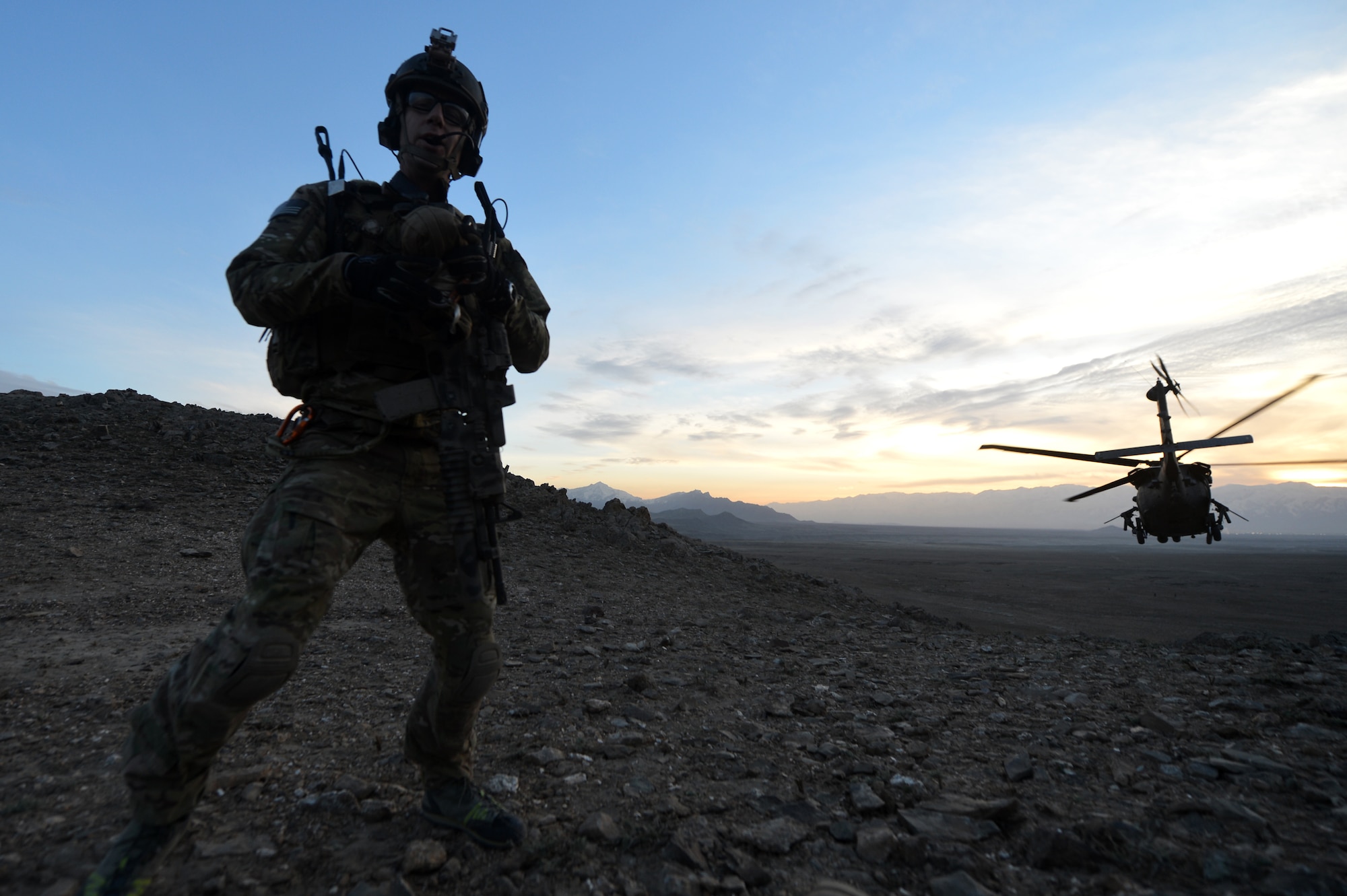 Maj. Joe Lopez, 83rd Expeditionary Rescue Squadron combat rescue officer, calls to the HH-60G Pave Hawk with a ground report outside of Bagram Airfield, Afghanistan, March 12, 2013. The 83rd ERQS Guardian Angel are comprised of three career fields: the CRO (combat rescue officer), the PJ (pararescuemen) and SERE (survival, evasion, resistance, escape).  (U.S. Air Force photo/Senior Airman Chris Willis)