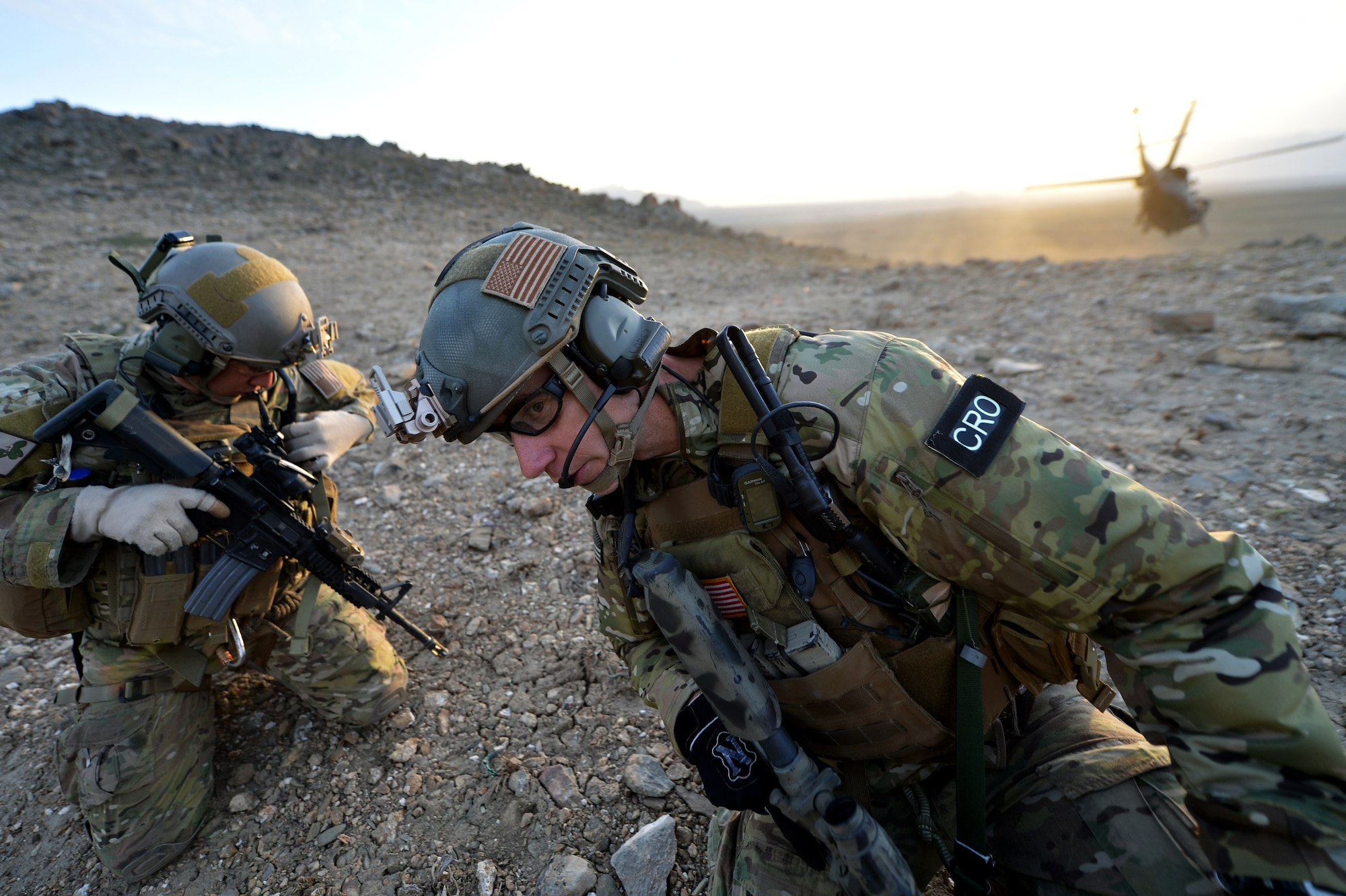 Tech. Sgt. Kenny Ortega and Maj. Joe Lopez, members of the 83rd Expeditionary Rescue Squadron Guardian Angel, arrive on-scene to attend to simulated casualties during a training mission outside of Bagram Airfield, Afghanistan, March 12, 2013. The 83rd ERQS Guardian Angel are comprised of three career fields: the CRO (combat rescue officer), the PJ (pararescuemen) and SERE (survival, evasion, resistance, escape).  (U.S. Air Force photo/Senior Airman Chris Willis)