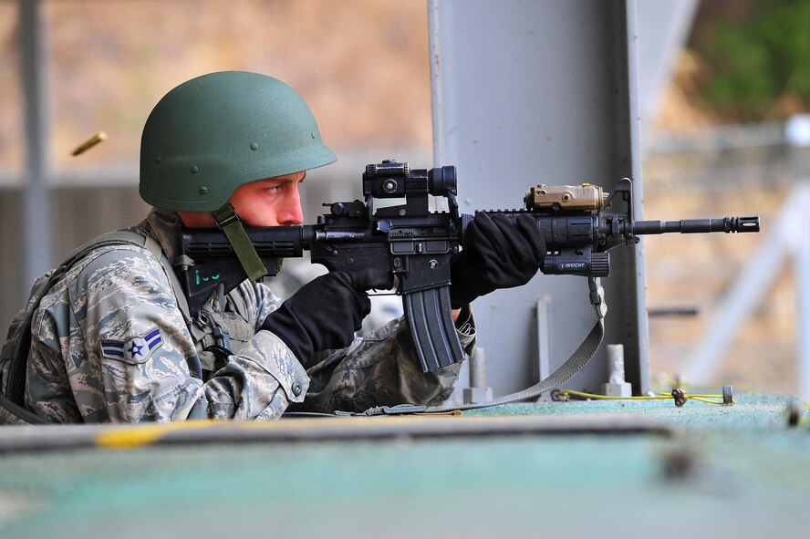 Airman 1st Class Charles Manarino, 51st Security Forces Squadron member, zeroes in his weapon before a shooting exercise at the Jinjui Air Force Education and Training Command firing range Republic of Korea, March 7, 2013. The air police special duty team course aims to train 51st SFS and ROK AF air police in tactics for base defense. (U.S. Air Force photo/Staff Sgt. Emerson Nuñez)