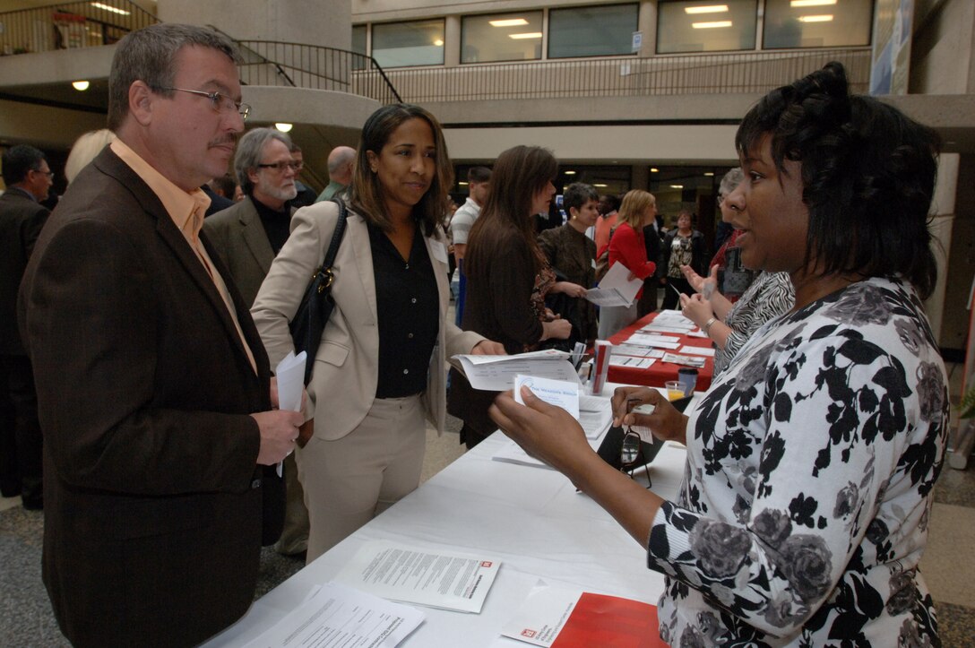 Nicole C. Boone (Right), U.S. Army Corps of Engineers Huntsville Engineering and Support Center, interacts with business owners and managers at the Tennessee Small Business Center on the Avon Williams Campus at Tennessee State University in Nashville, Tenn., during the Small Business Training Forum March 13, 2013. (USACE photo by Leon Roberts)
