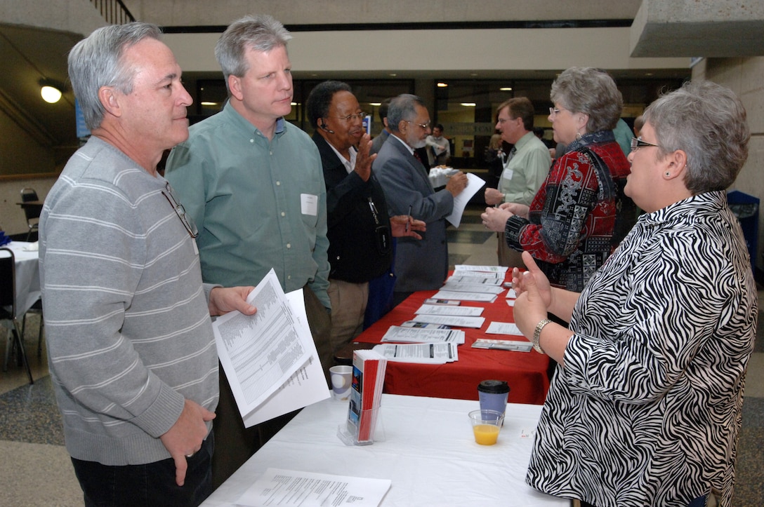 Jacque Gee (Right), deputy for Small Business with the U.S. Army Corps of Engineers Louisville District, provides information to customers at the Tennessee Small Business Center on the Avon Williams Campus at Tennessee State University in Nashville, Tenn., during the Small Business Training Forum March 13, 2013. (USACE photo by Leon Roberts)