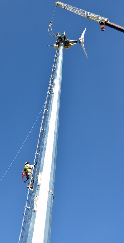 A contractor in a safety harness climbs the 120-foot tower of Black Butte Lake’s wind turbine during its assembly March 13, 2013. Expected to go online within 30 days, the turbine can generate 11 kilowatts of energy and will help supply the needs of campers at the U.S. Army Corps of Engineers Sacramento District park near Orland, Calif.