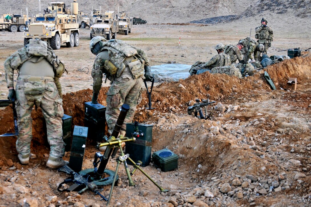 U.S. soldiers prepare fighting positions to support coalition forces during Operation Southern Fist III in the Spin Boldak district of Afghanistan's Kandahar province, March 4, 2013. The soldiers are assigned to the 2nd Infantry Division's Company B, 2nd Battalion, 23rd Infantry Regiment, 4th Stryker Brigade Combat Team.