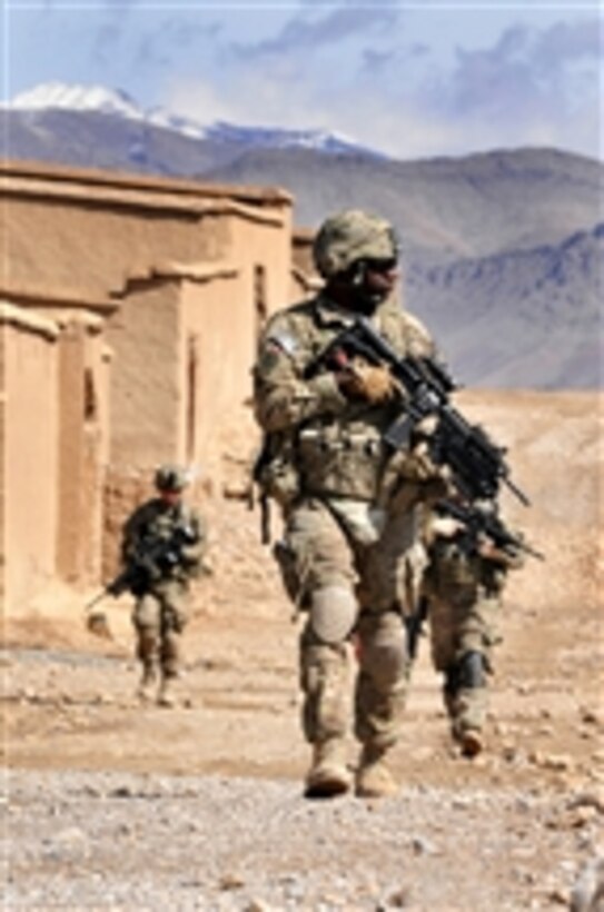 U.S. Army Sgt. Tyger Benoit and members of Charlie Company, 2nd Brigade Combat Team, 3rd Infantry Division, patrol through the Uruzgan province of Afghanistan, on Feb. 23, 2013.  The team is en route to Forward Operating Base Mirwais after mentoring local police officers at the Afghan Uniform Police District headquarters. 