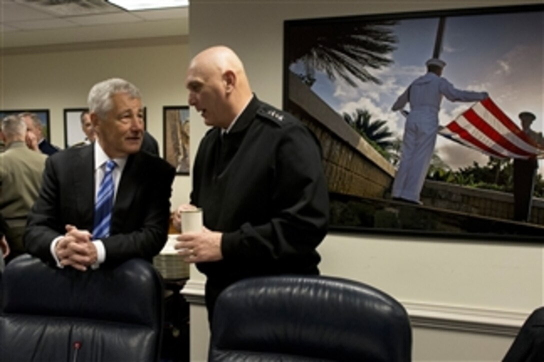 Secretary of Defense Chuck Hagel speaks with U.S. Army Chief of Staff Gen. Ray Odierno before a meeting with his Senior Leadership Council in the Pentagon on March 14, 2013.  Hagel met with the service chiefs, combatant commanders and senior department civilians to discuss upcoming budget issues as well as the state of the department.   