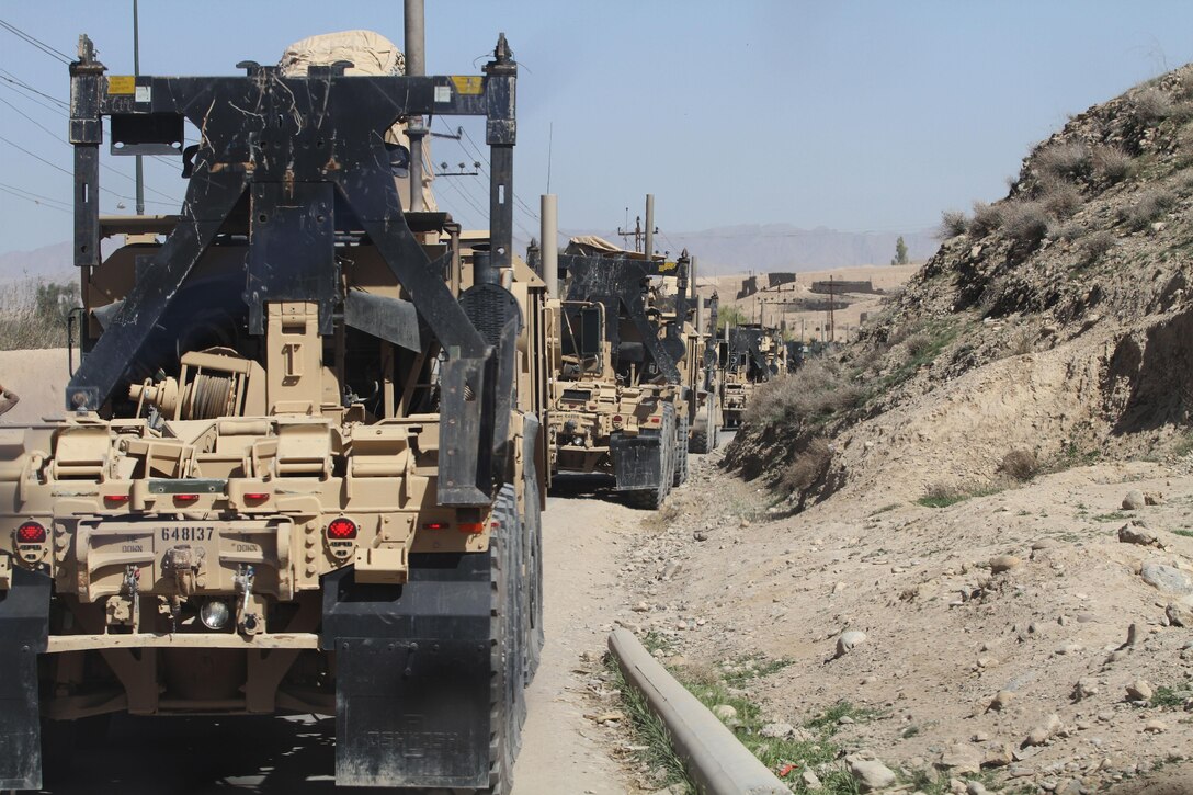 Marines with 3rd Platoon, Transport Support Company, Combat Logistics Regiment 2, drive around a bend in route to Forward Operating Base Shamsher, March 10.