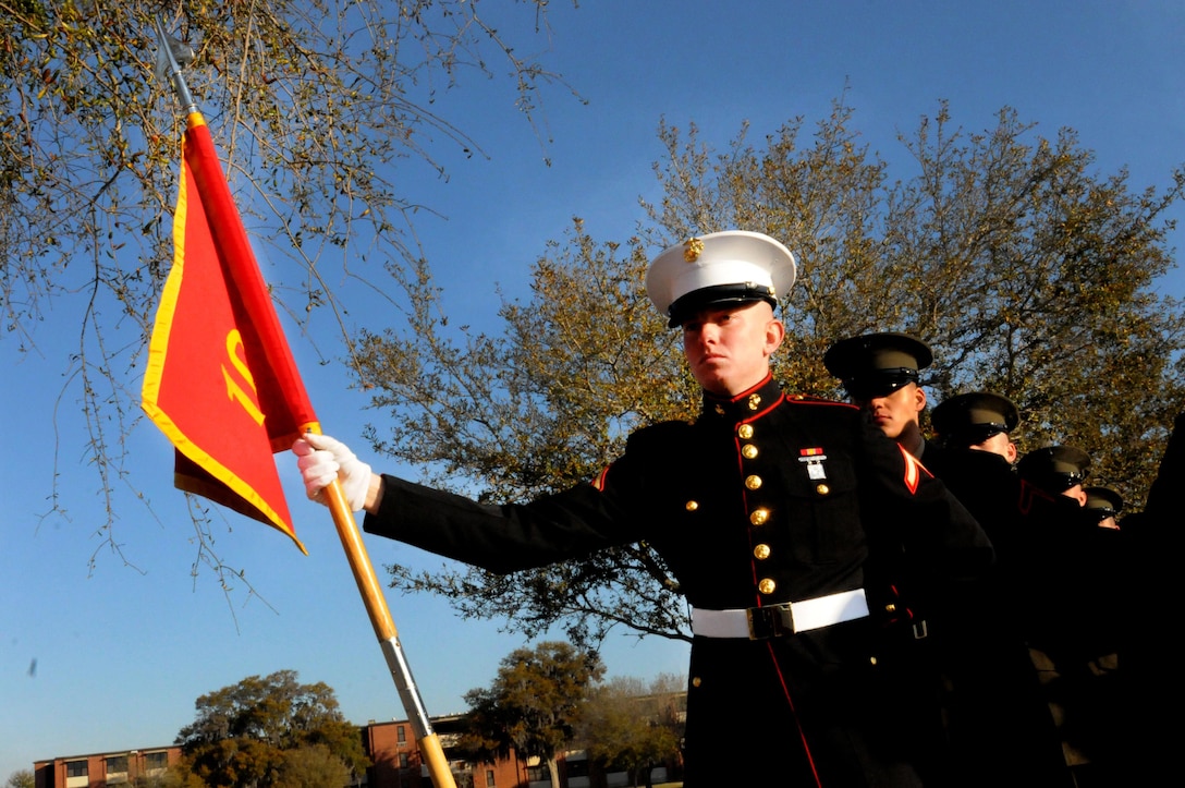 Private First Class Ghannon Burton, honor graduate of platoon 1018, stands at parade rest before graduation aboard Parris Island, S.C., March 15, 2013. Burton, a native of Belmont, Miss., was recruited by Sgt Robert Anderson out of RSS Tuscaloosa.  Burton will be able to enjoy some well deserved leave with his family after graduation. (U.S. Marine Corps photo by Cpl. Gabrielle Bustos)